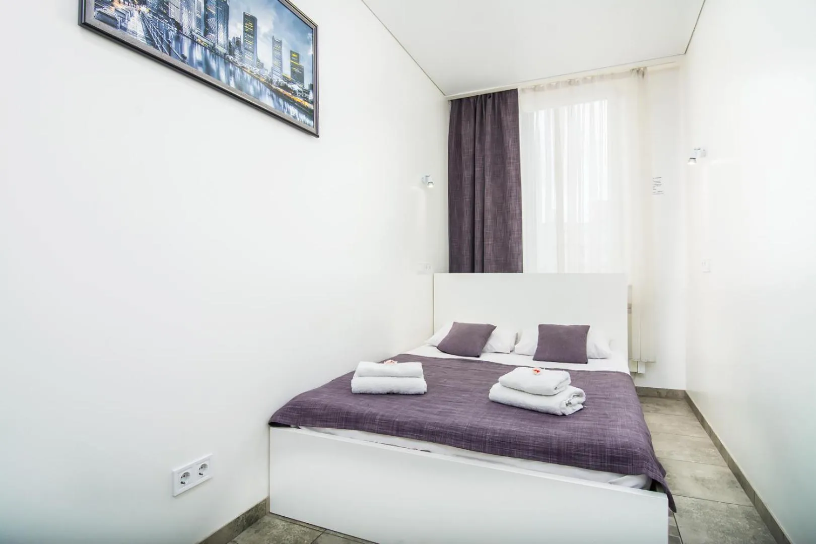 Bed in SkyHome Mini-hotel