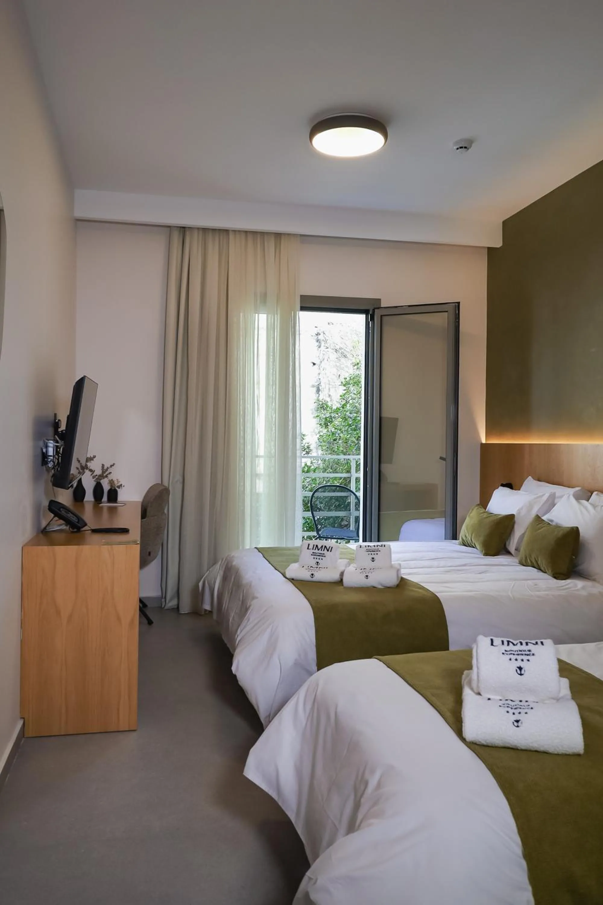 Photo of the whole room, Bed in LIMNI Boutique Experience Evia