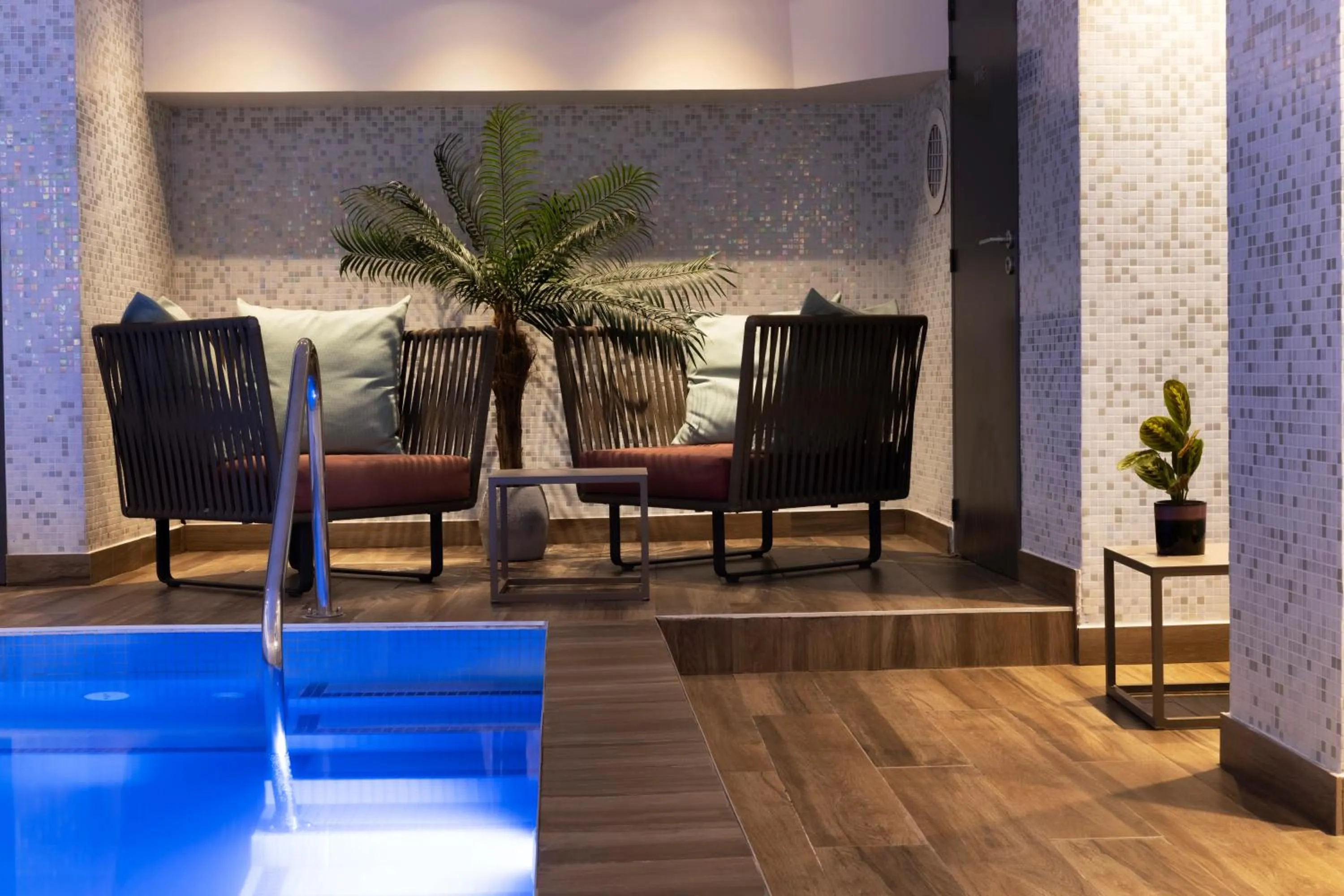 Swimming pool in Les Matins de Paris & Spa