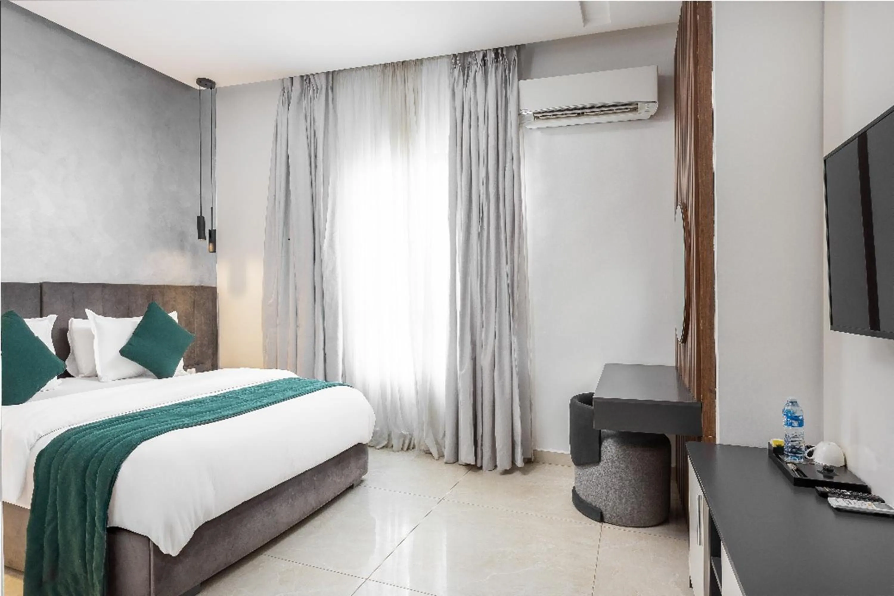 Bed in Vertus Hotel and Suites