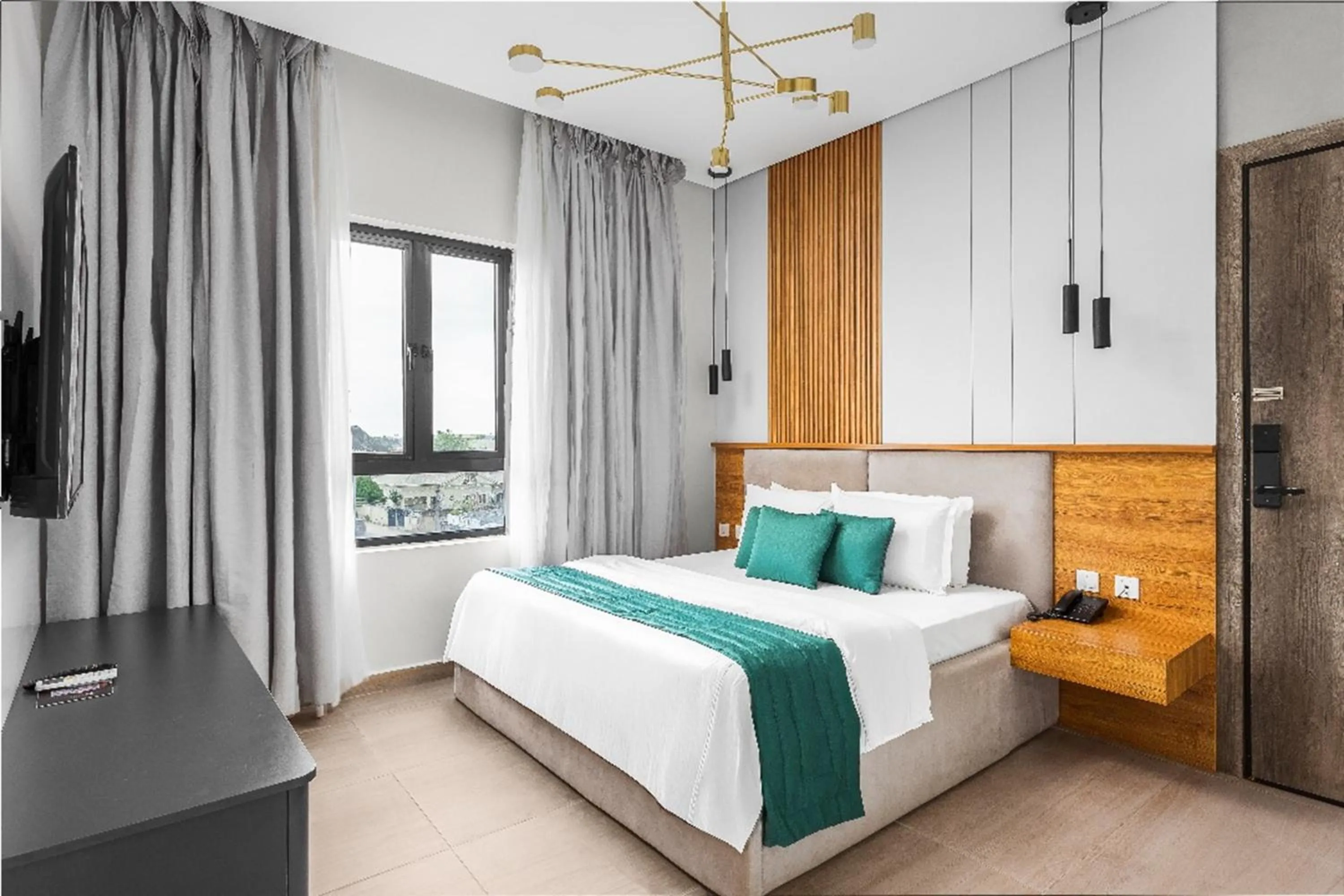 Bed in Vertus Hotel and Suites
