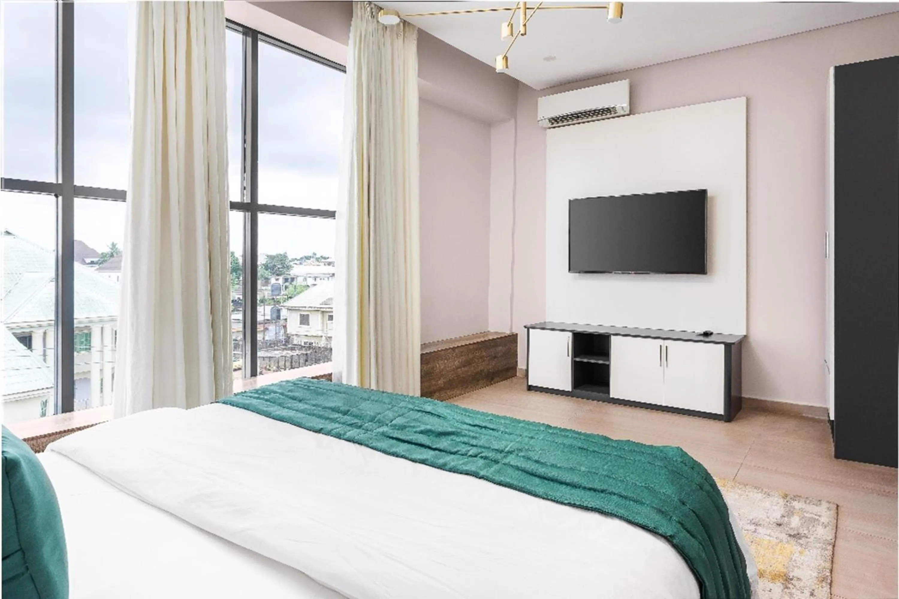 Bed in Vertus Hotel and Suites