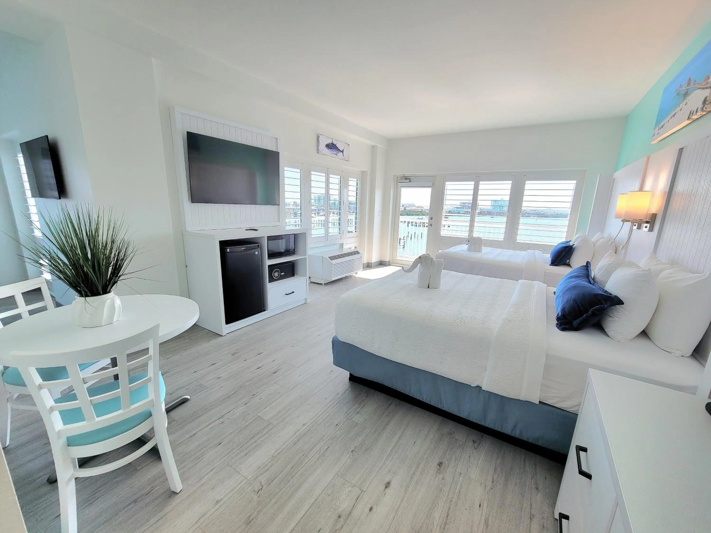 Bed in ChartHouse Clearwater Beach Marina Hotel