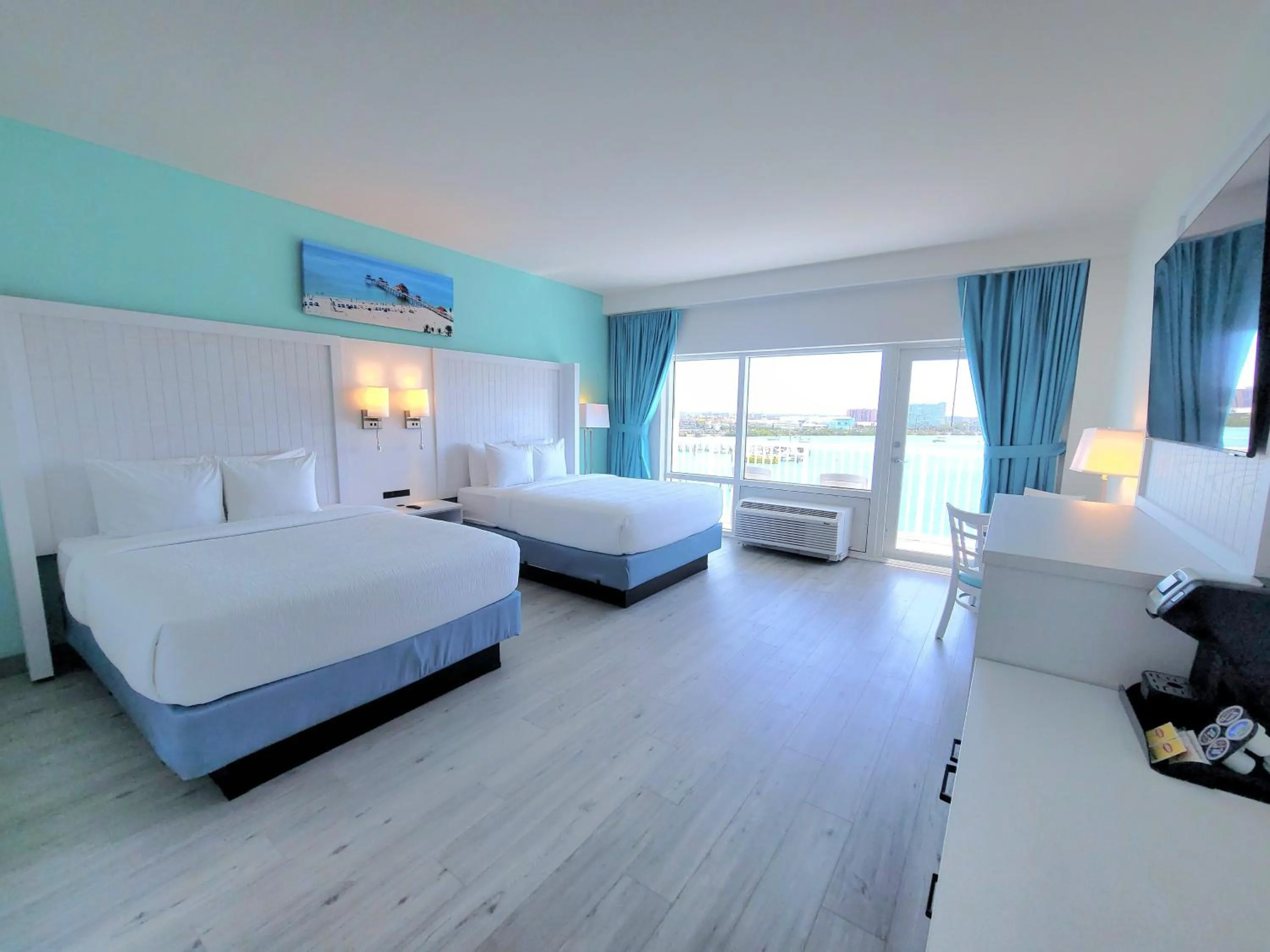 Bed in ChartHouse Clearwater Beach Marina Hotel