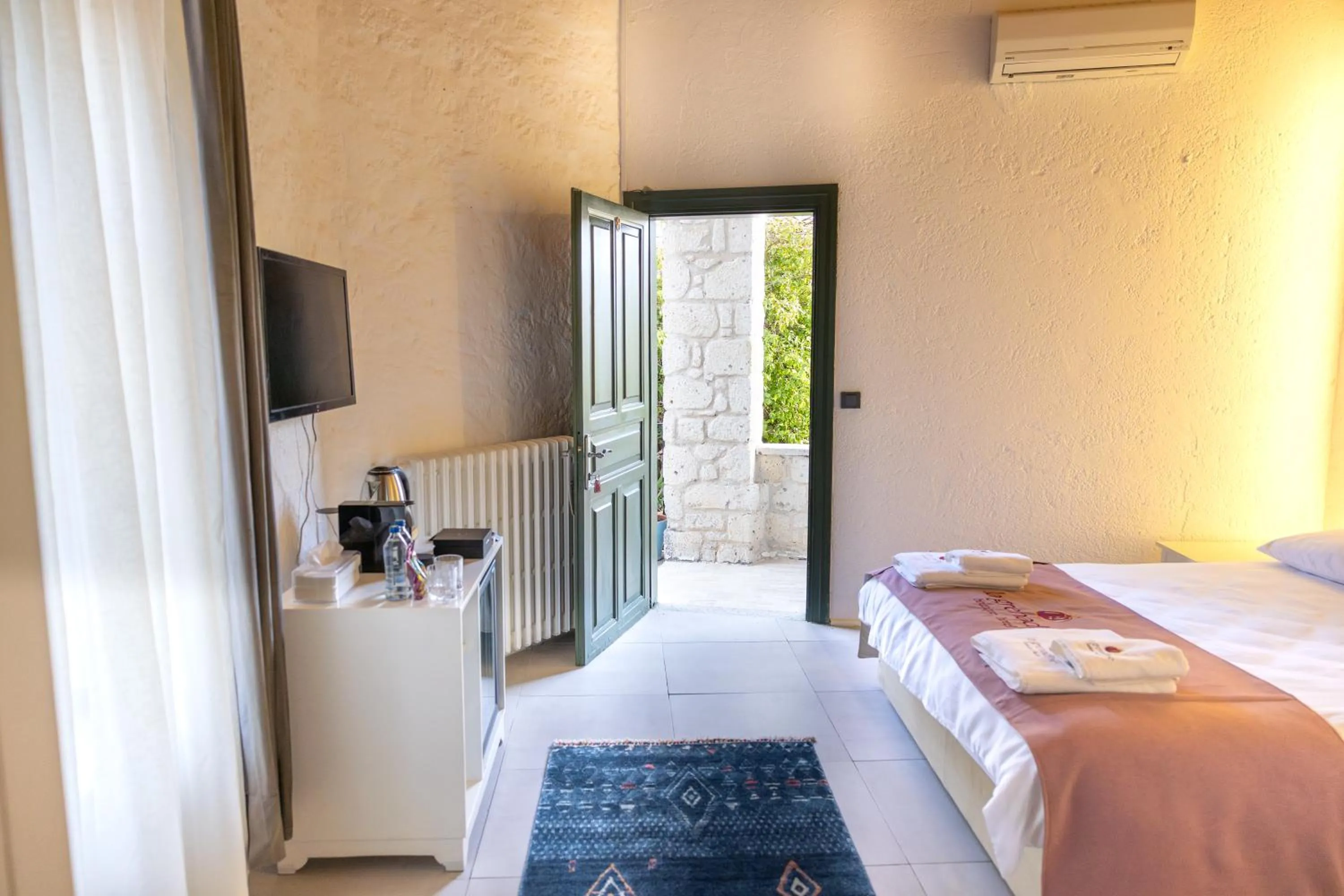 Bed in La Grenadine Hotel