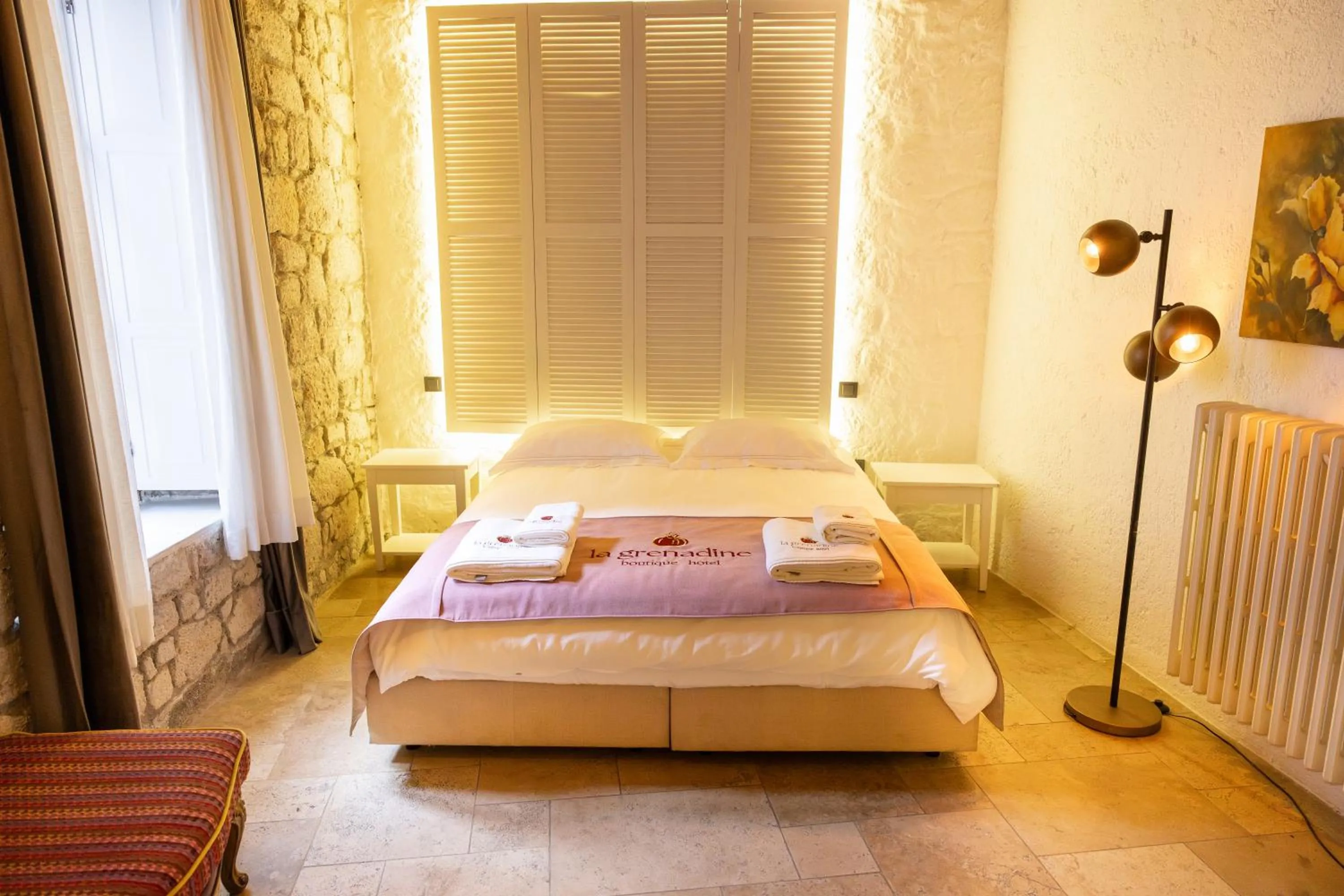 Bed in La Grenadine Hotel