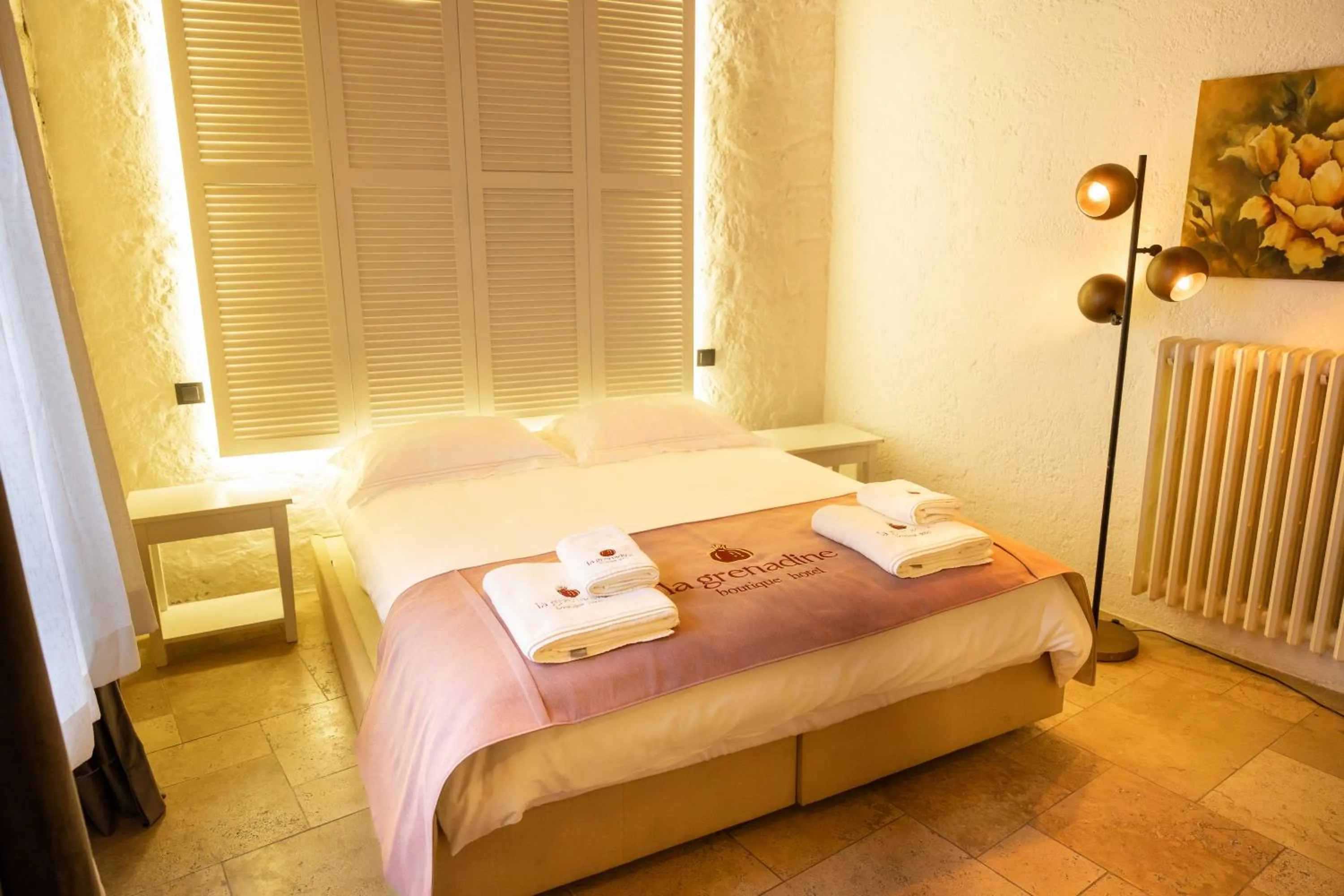 Bed in La Grenadine Hotel
