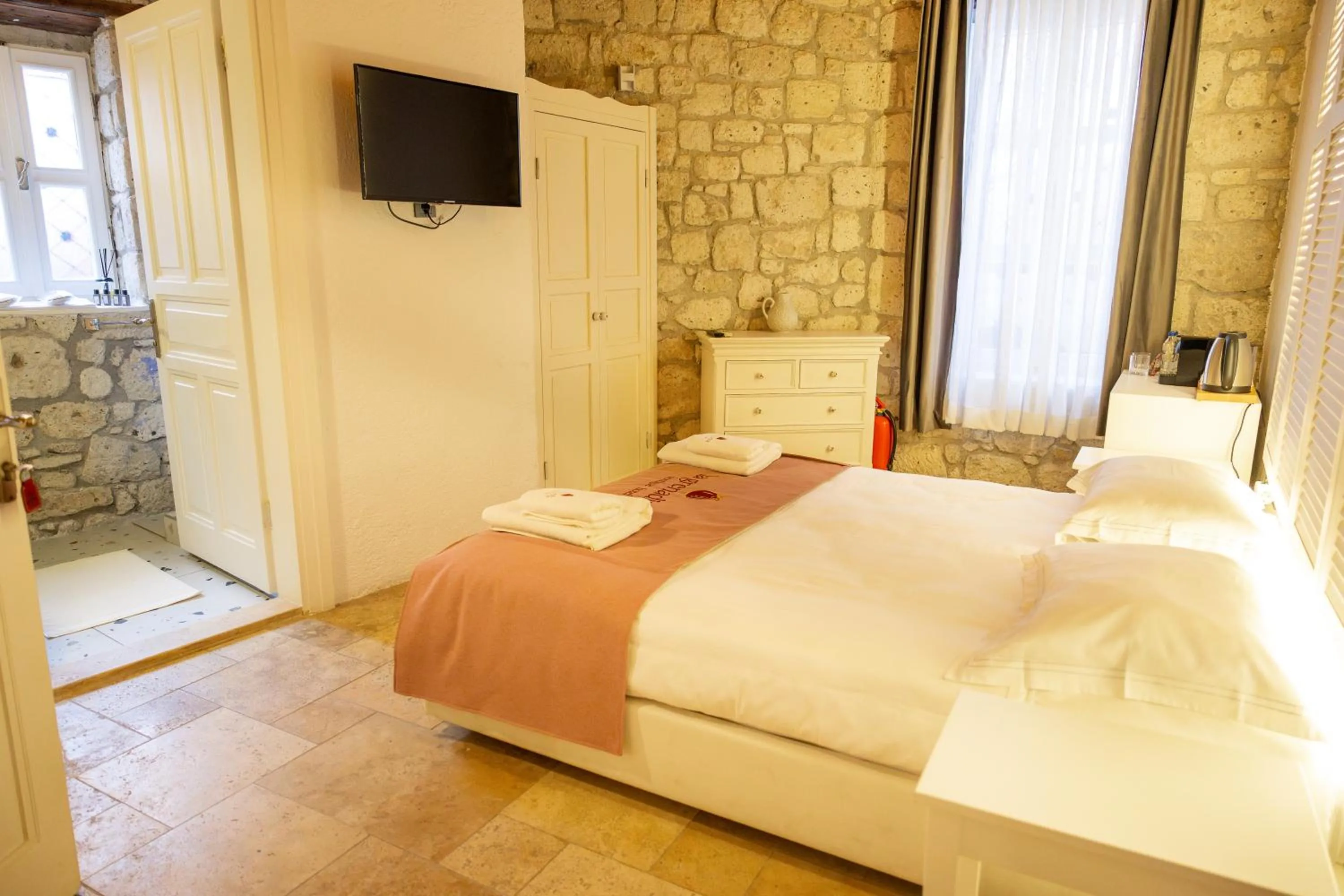 Bed in La Grenadine Hotel