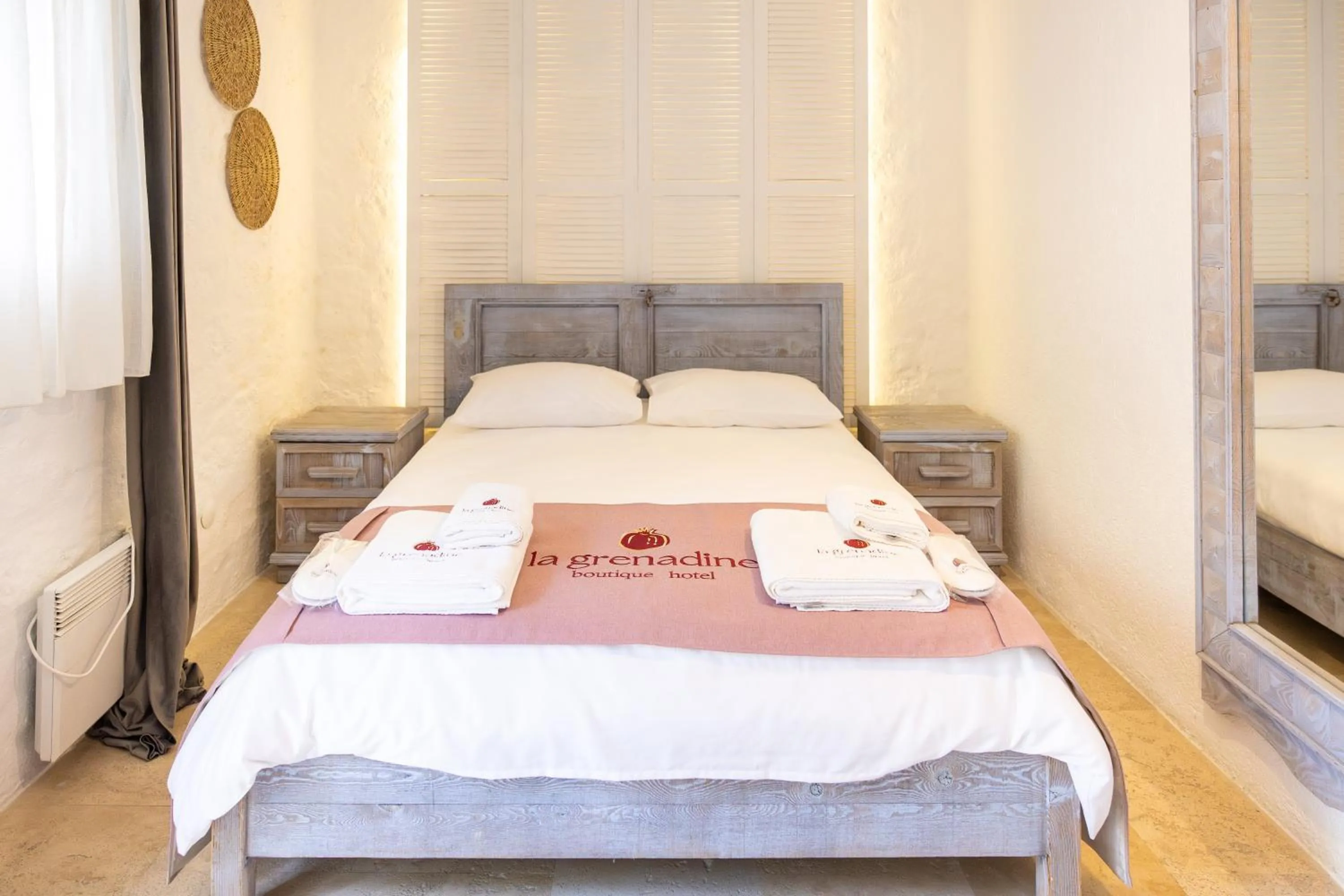 Bed in La Grenadine Hotel