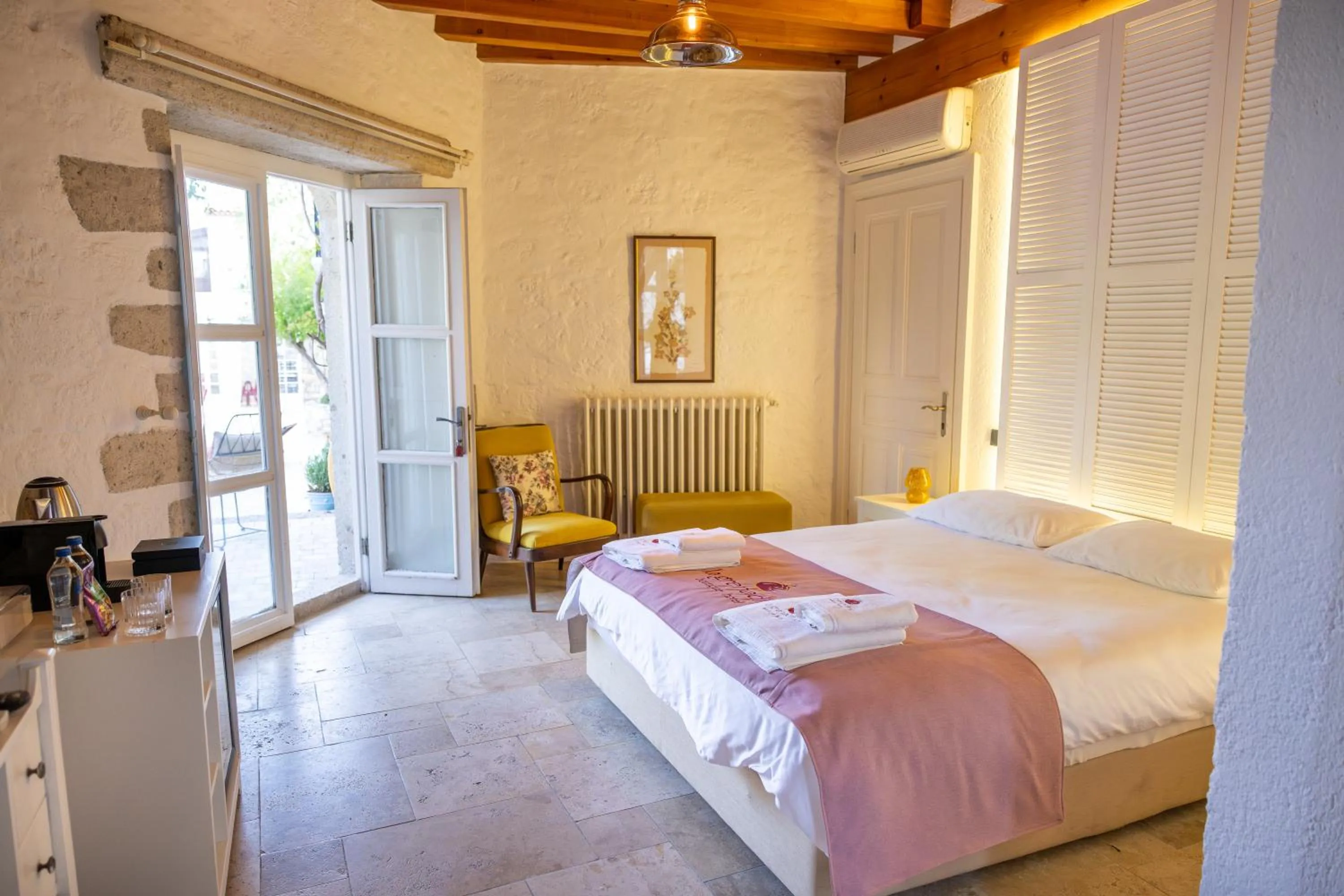 Bed in La Grenadine Hotel