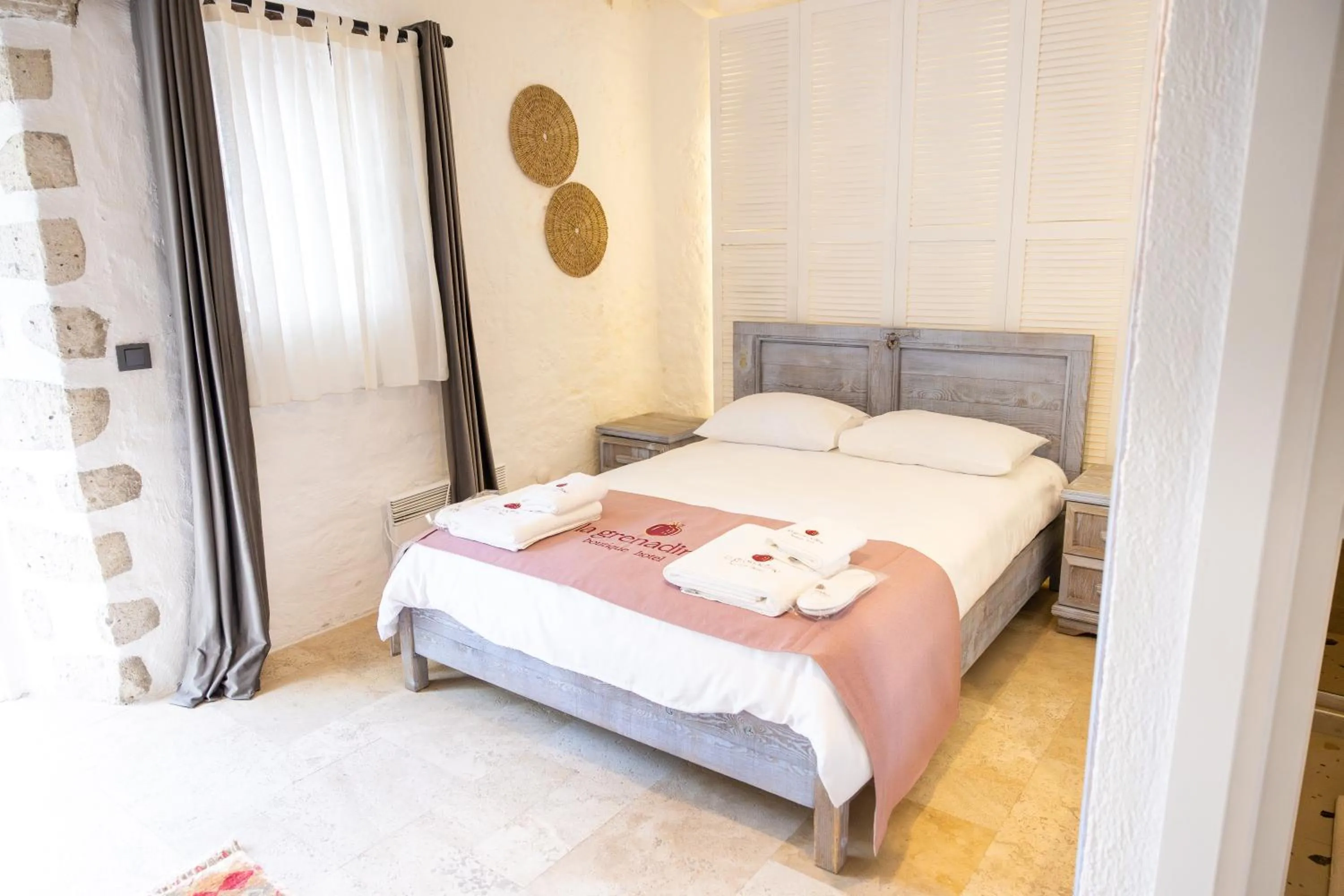 Bed in La Grenadine Hotel
