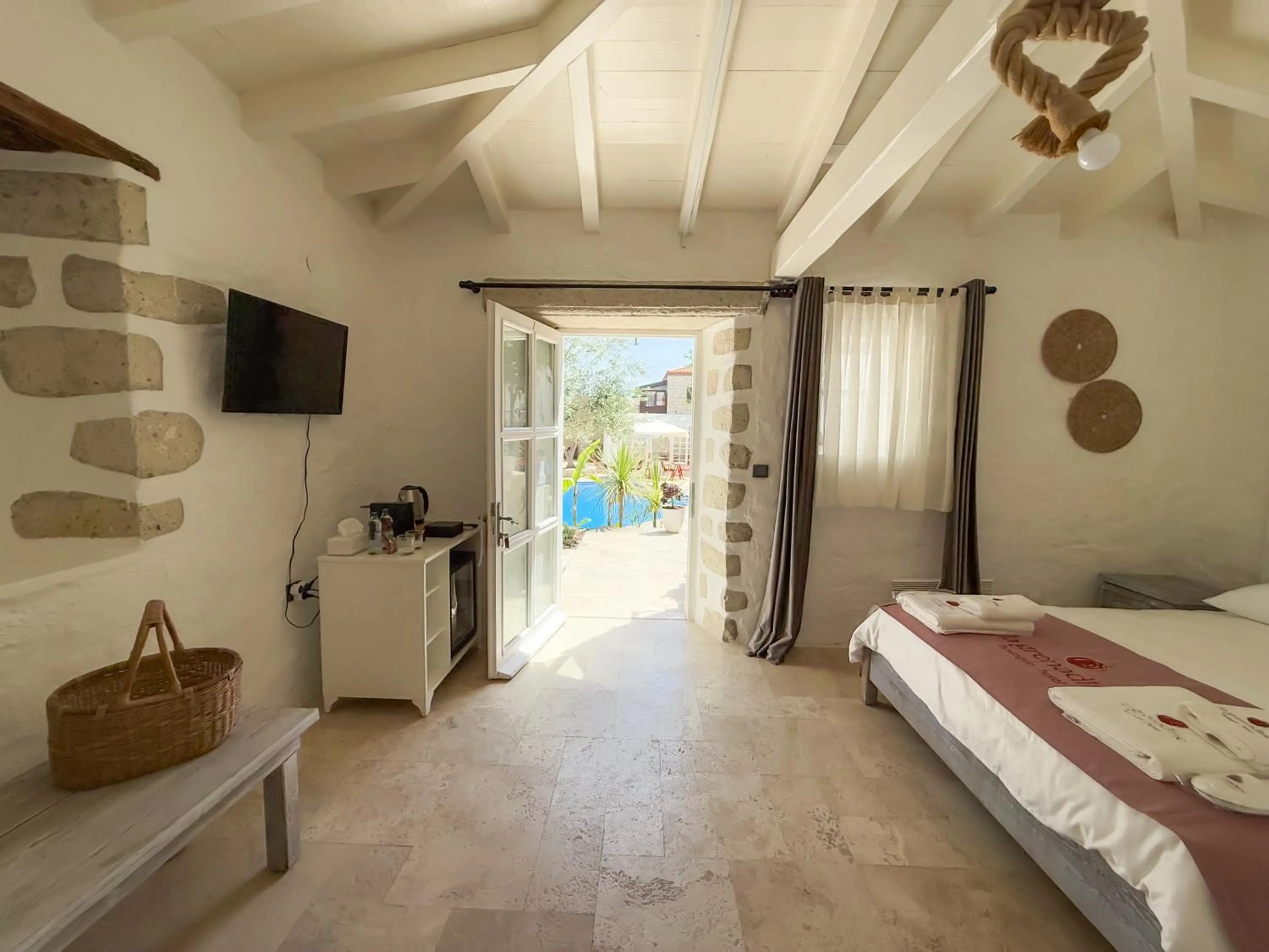 Bed in La Grenadine Hotel