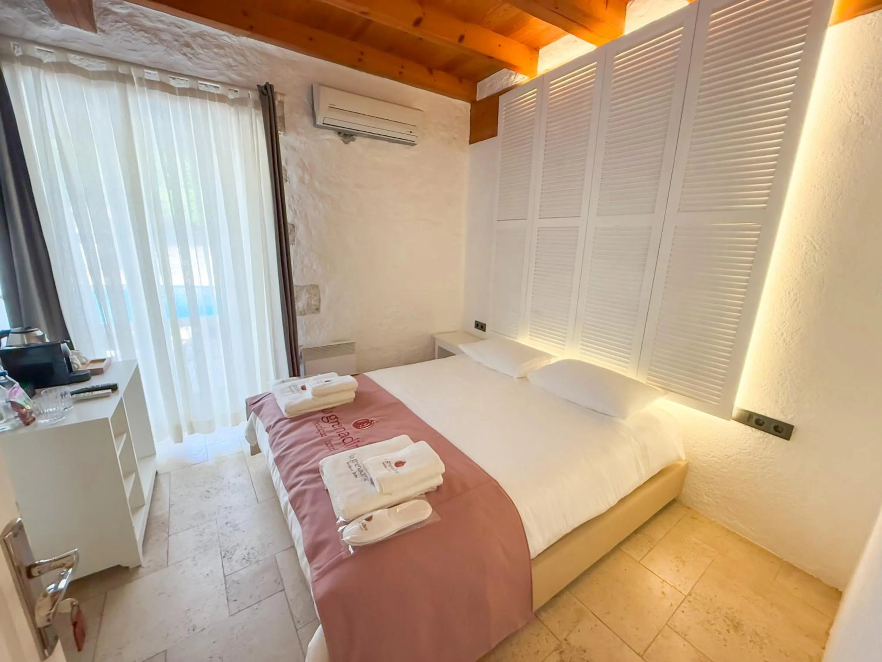 Bed in La Grenadine Hotel