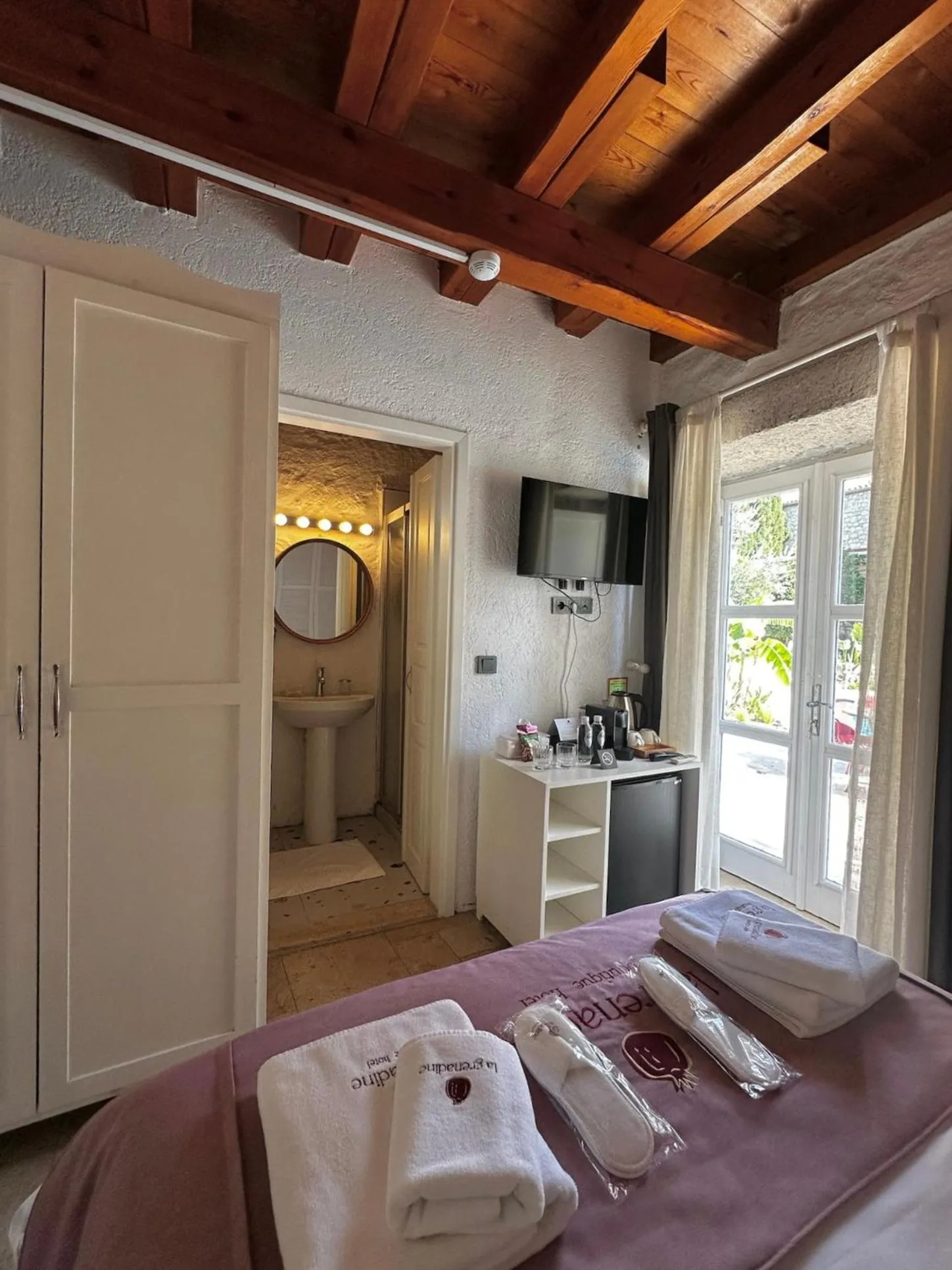 Bed in La Grenadine Hotel
