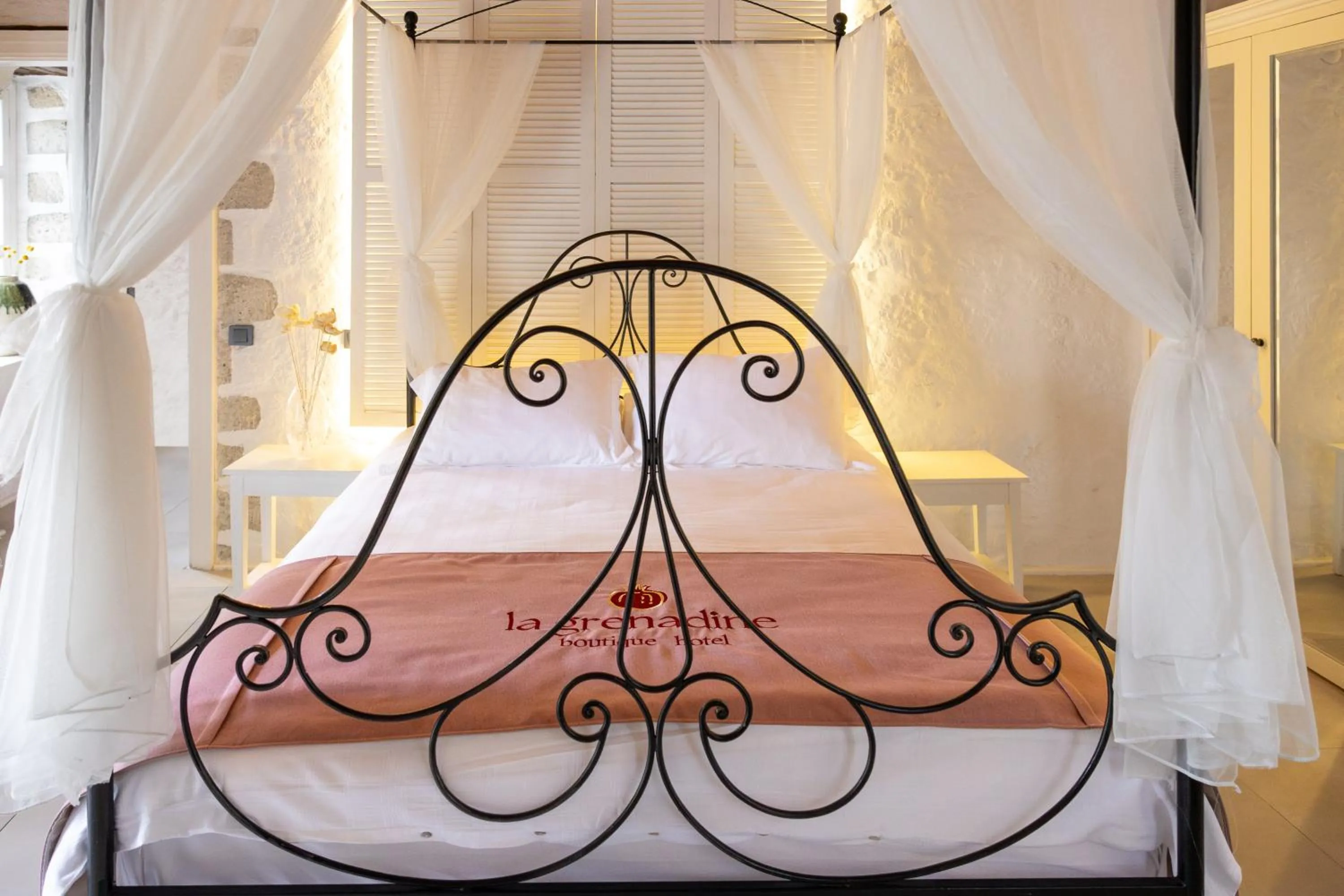 Bed in La Grenadine Hotel