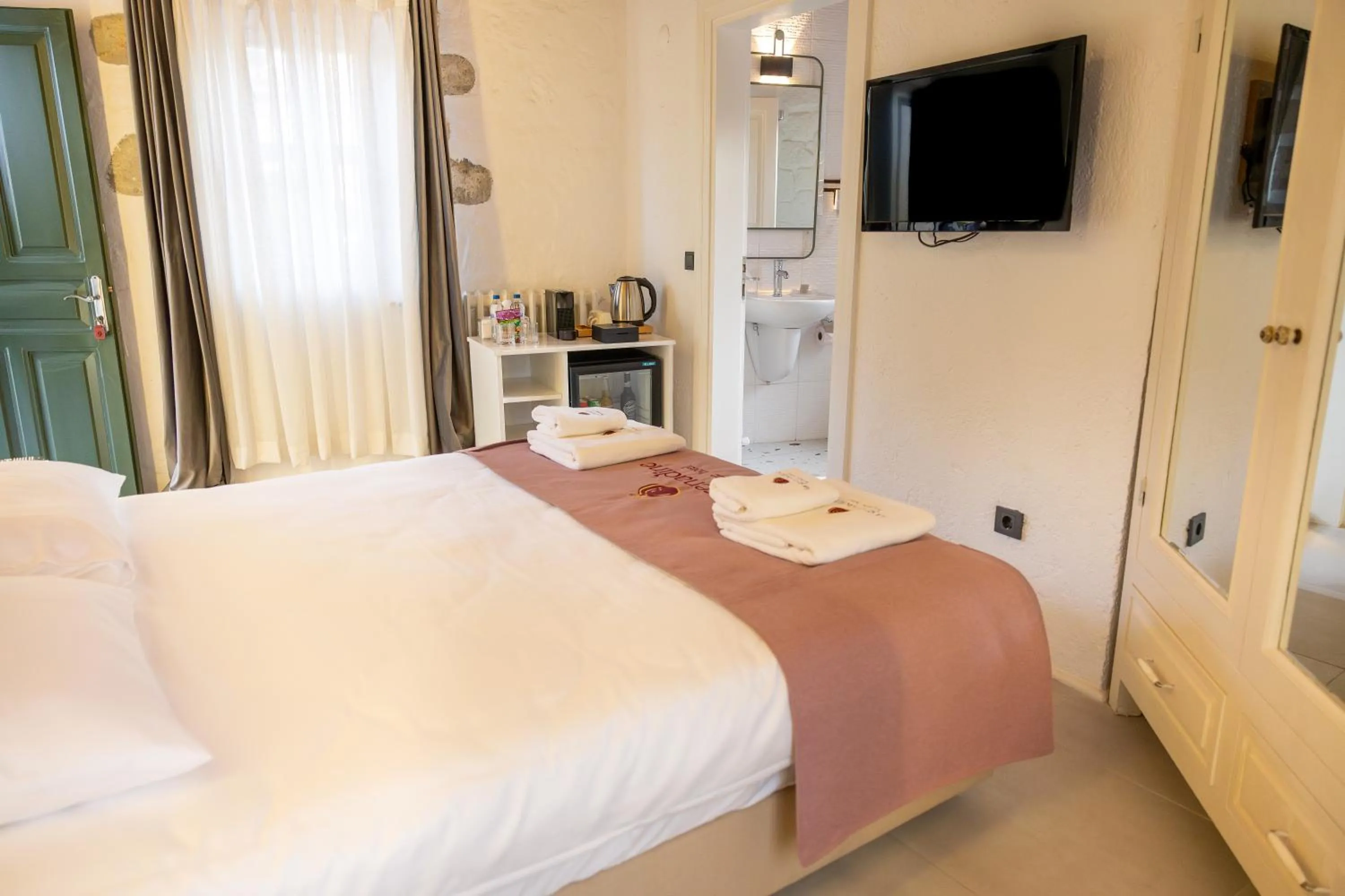 Bed in La Grenadine Hotel