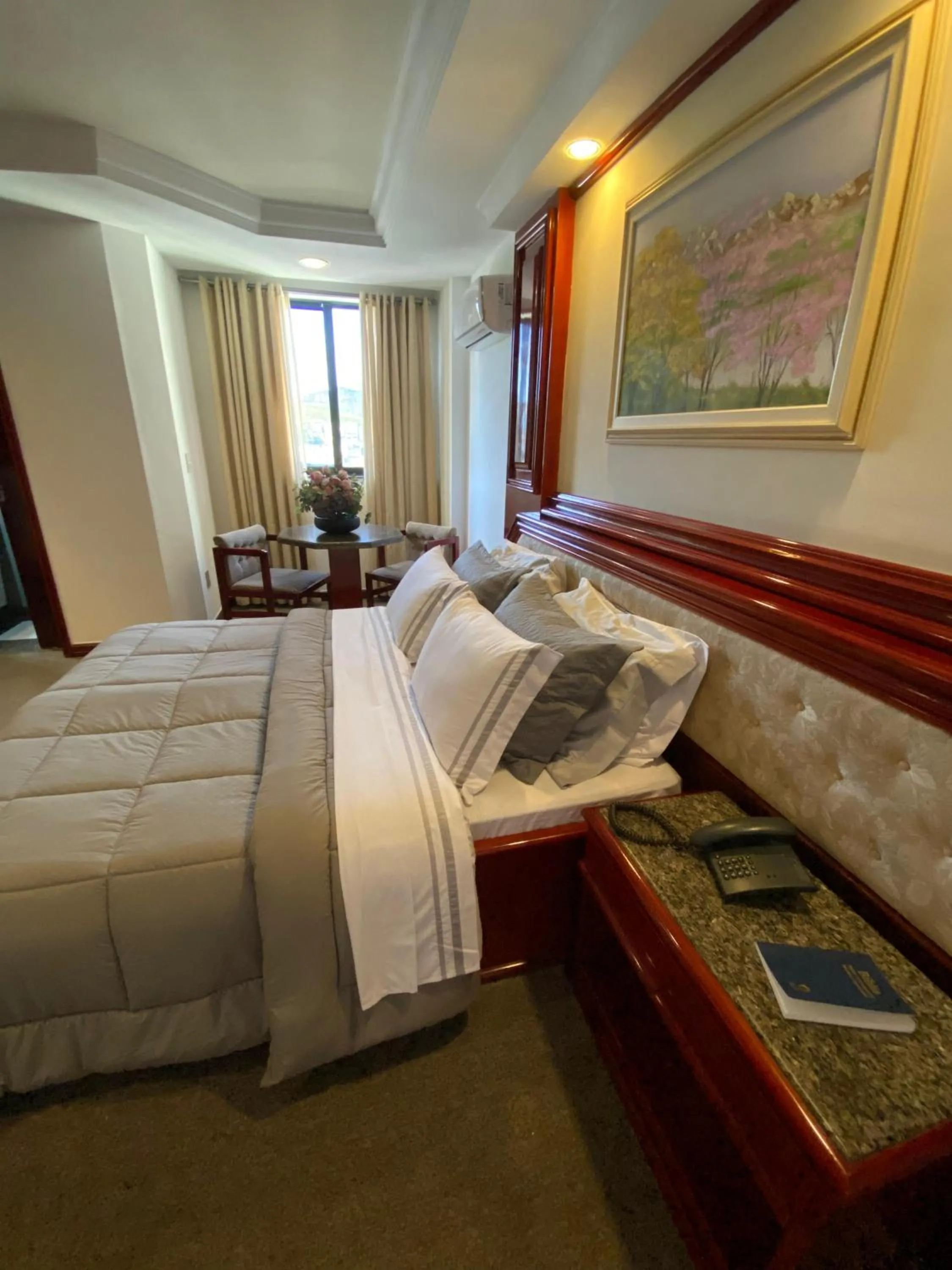 Bed in Maxim Plaza Hotel