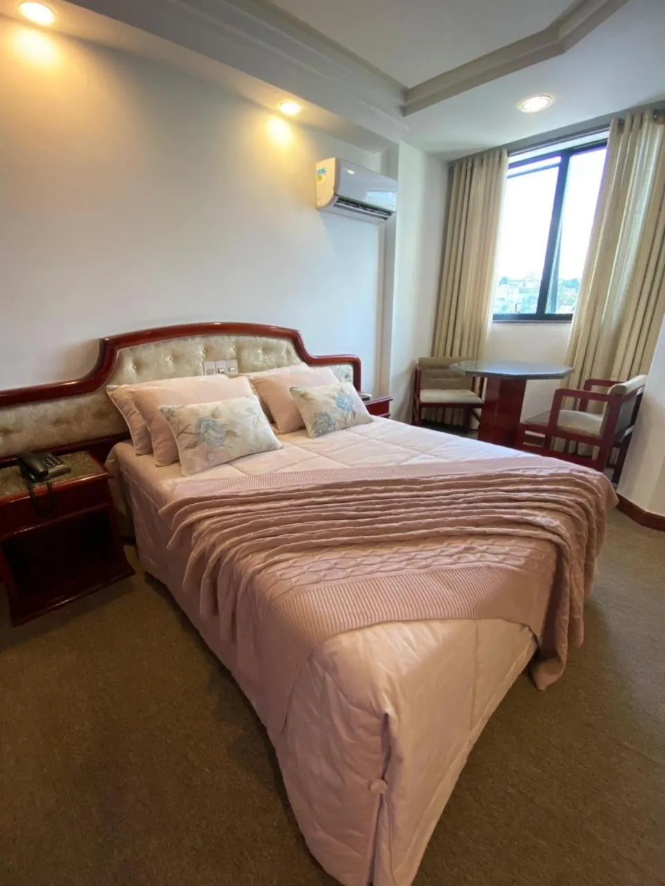 Bed in Maxim Plaza Hotel
