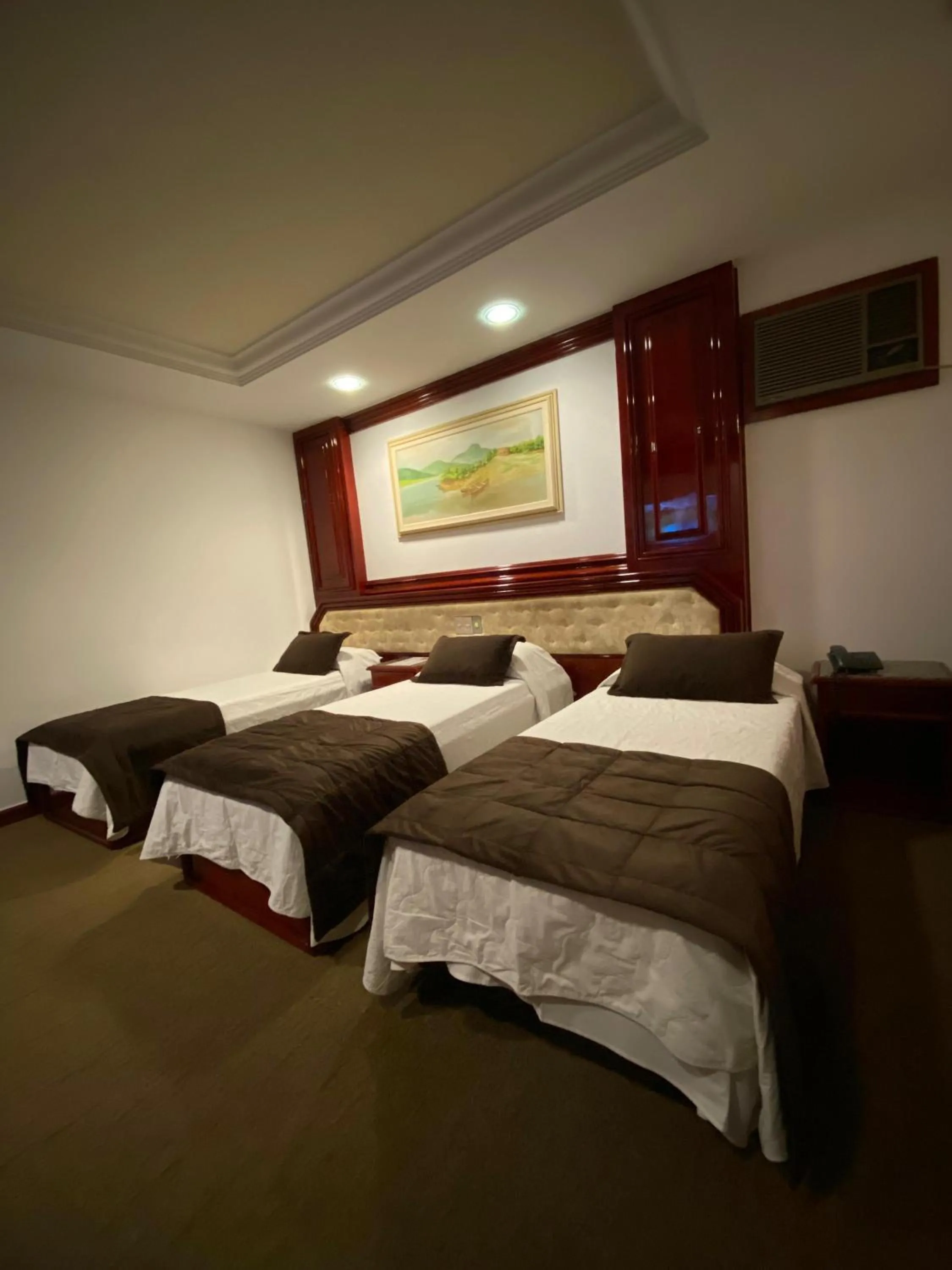 Bed in Maxim Plaza Hotel