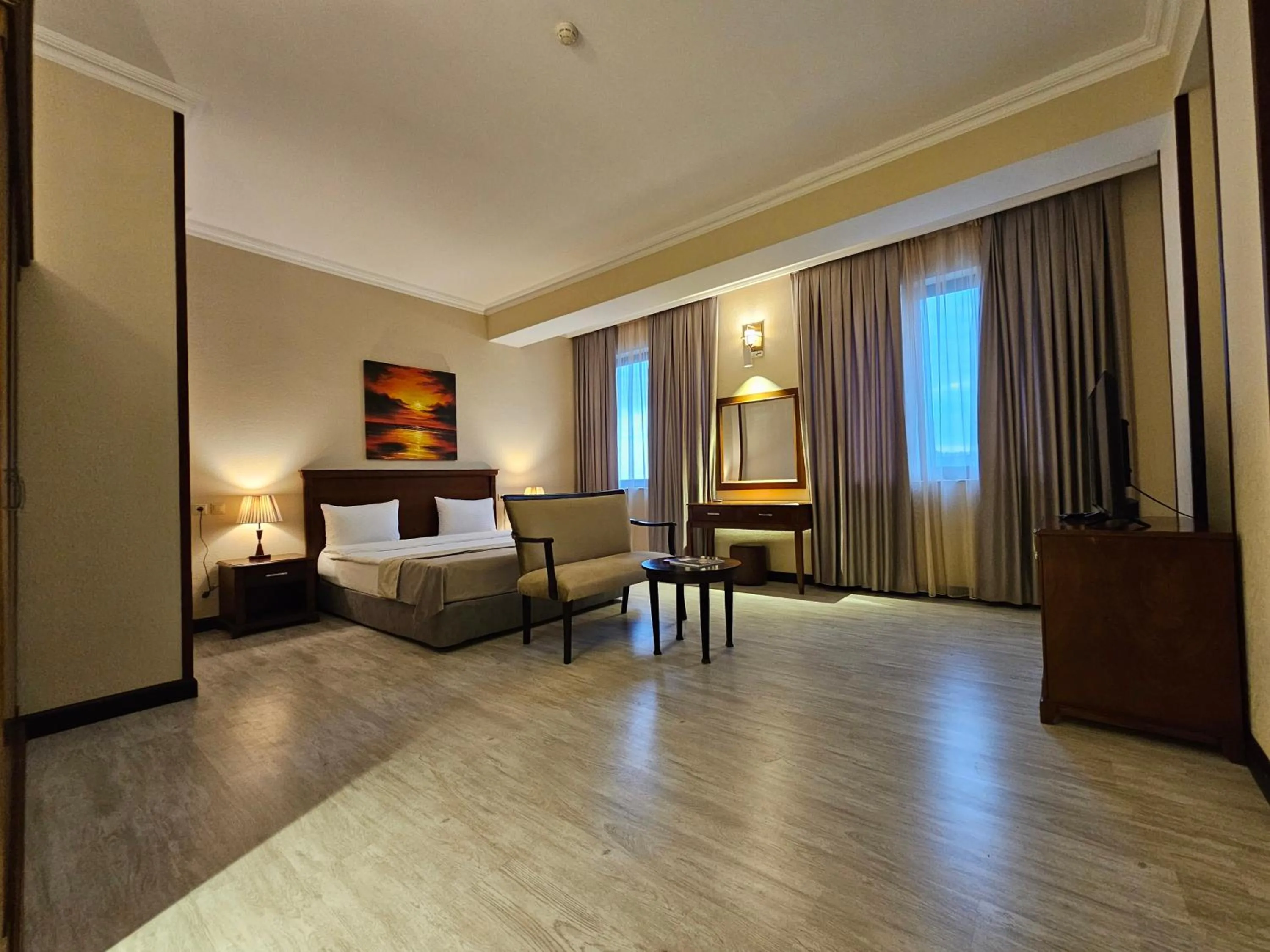 Bed in Crown Suites Hotel