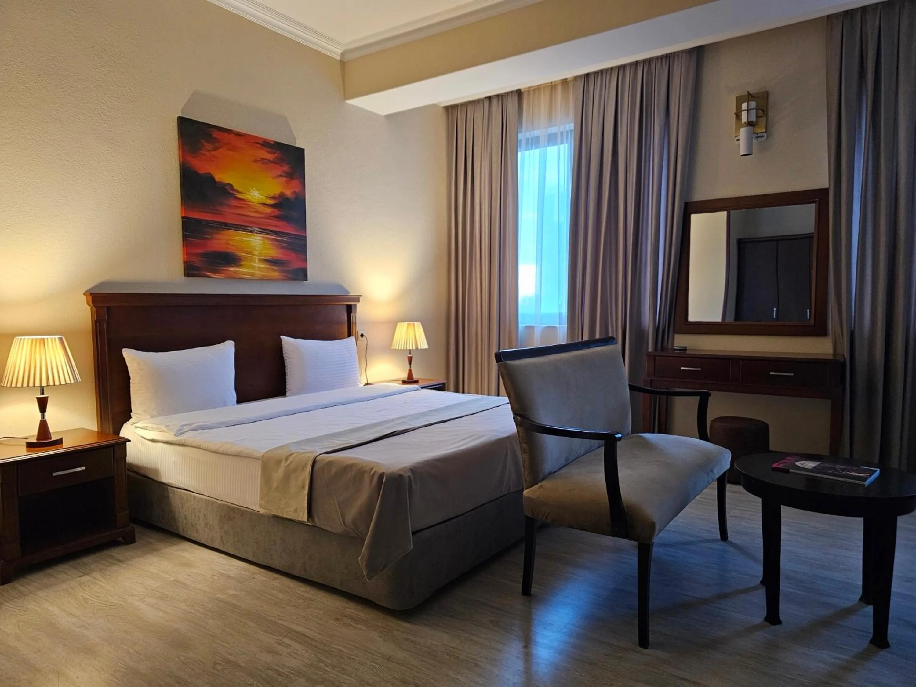 Bed in Crown Suites Hotel