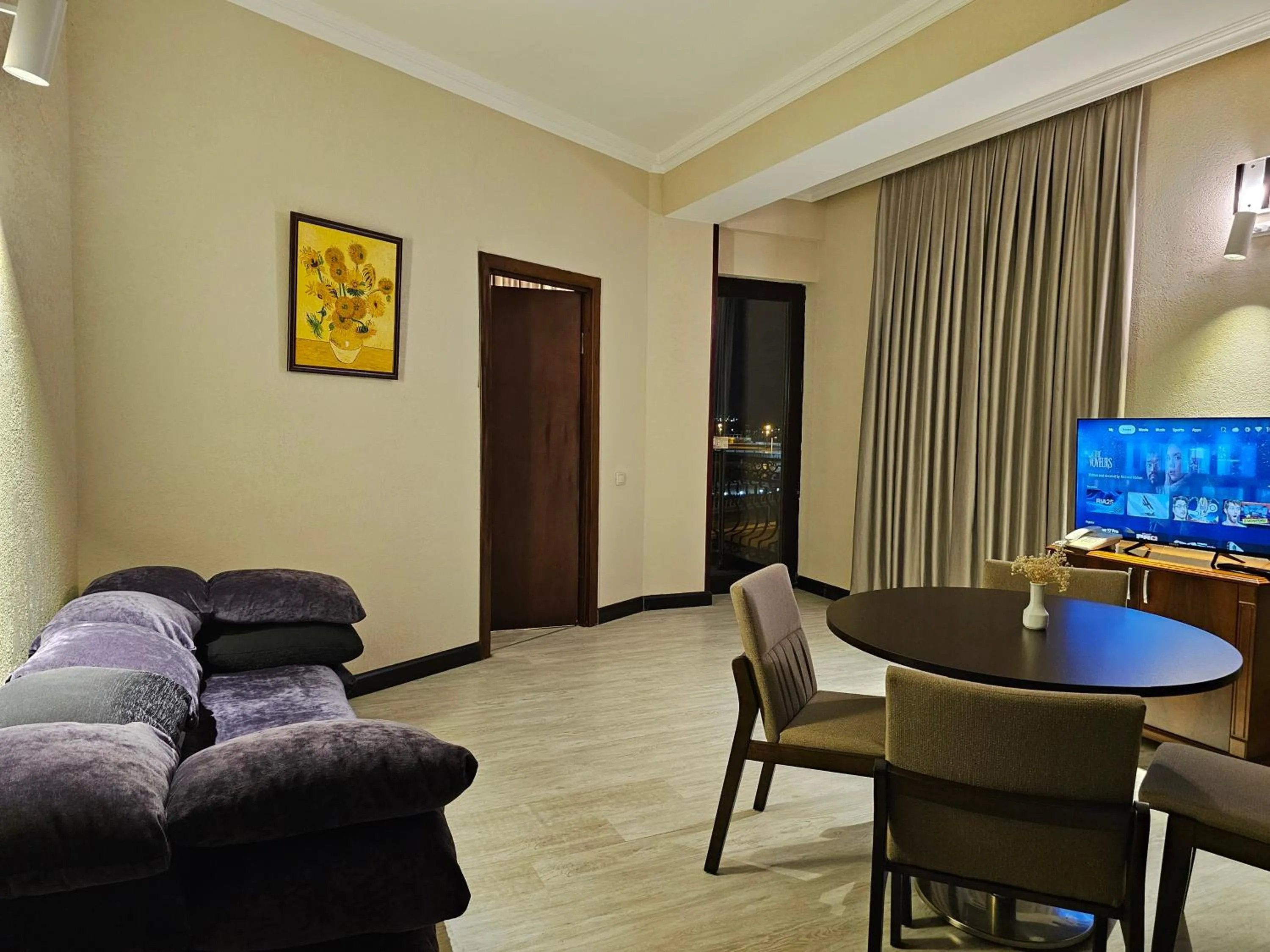 Communal lounge/ TV room in Crown Suites Hotel