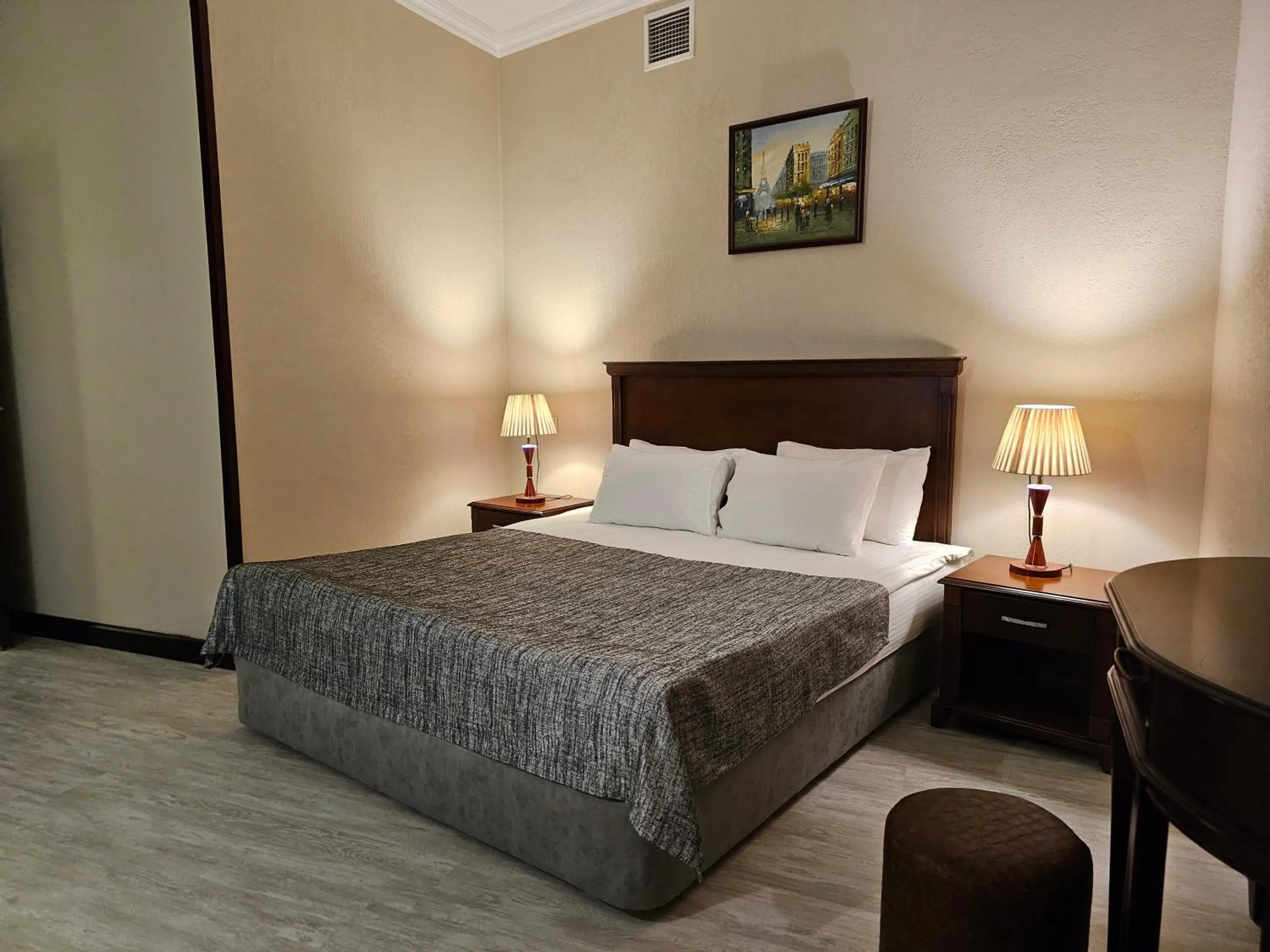 Bed in Crown Suites Hotel