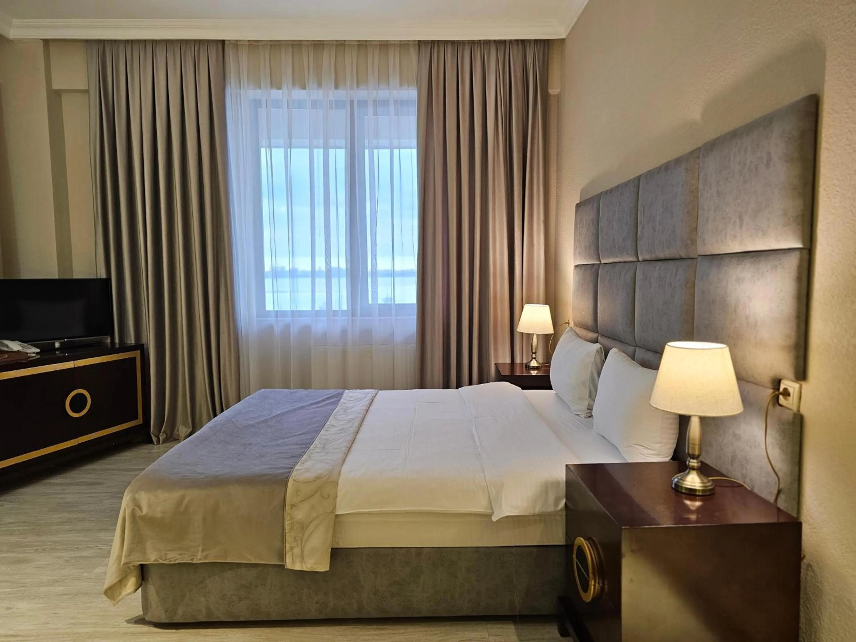 Bed in Crown Suites Hotel