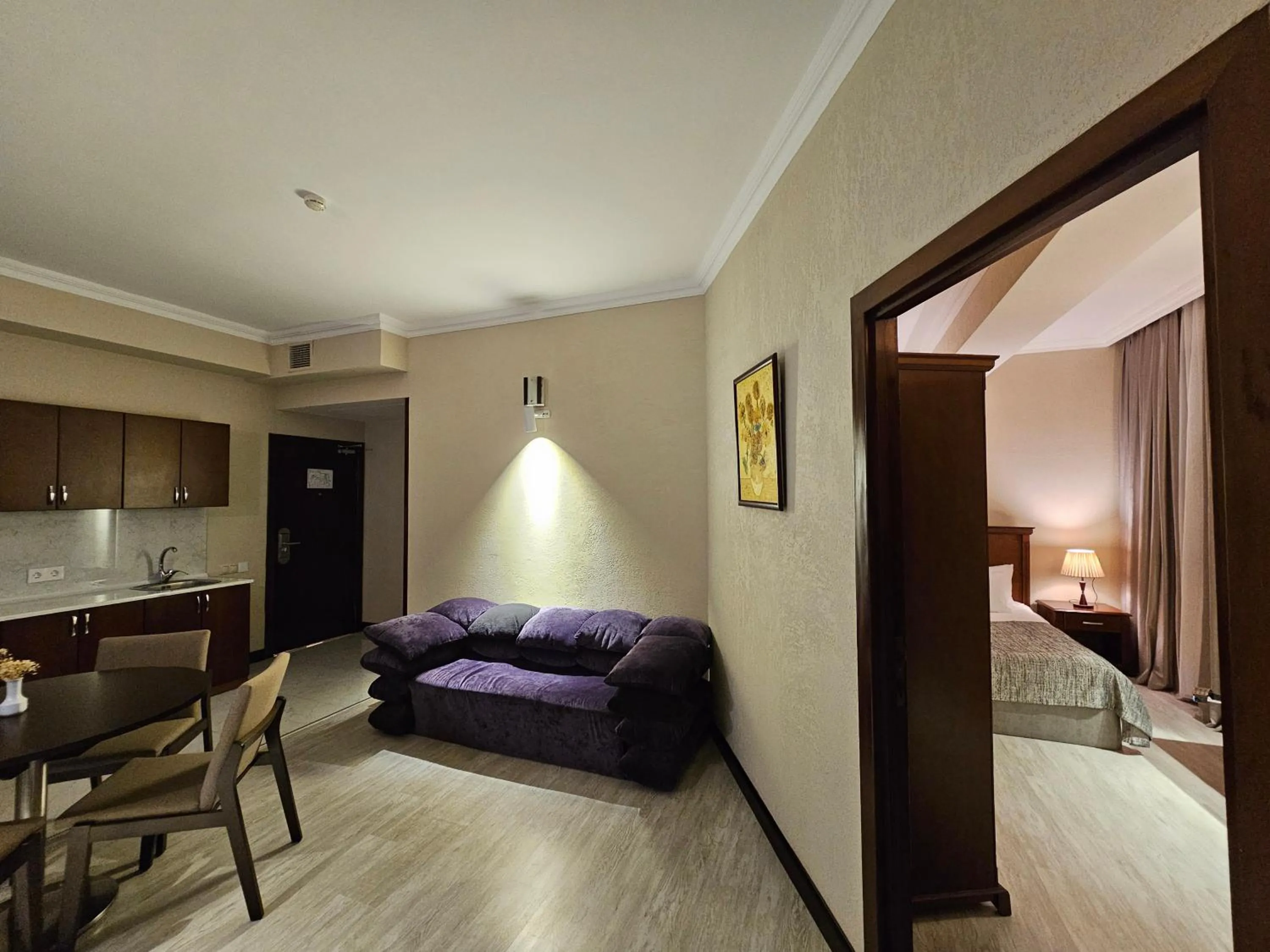 Bed in Crown Suites Hotel