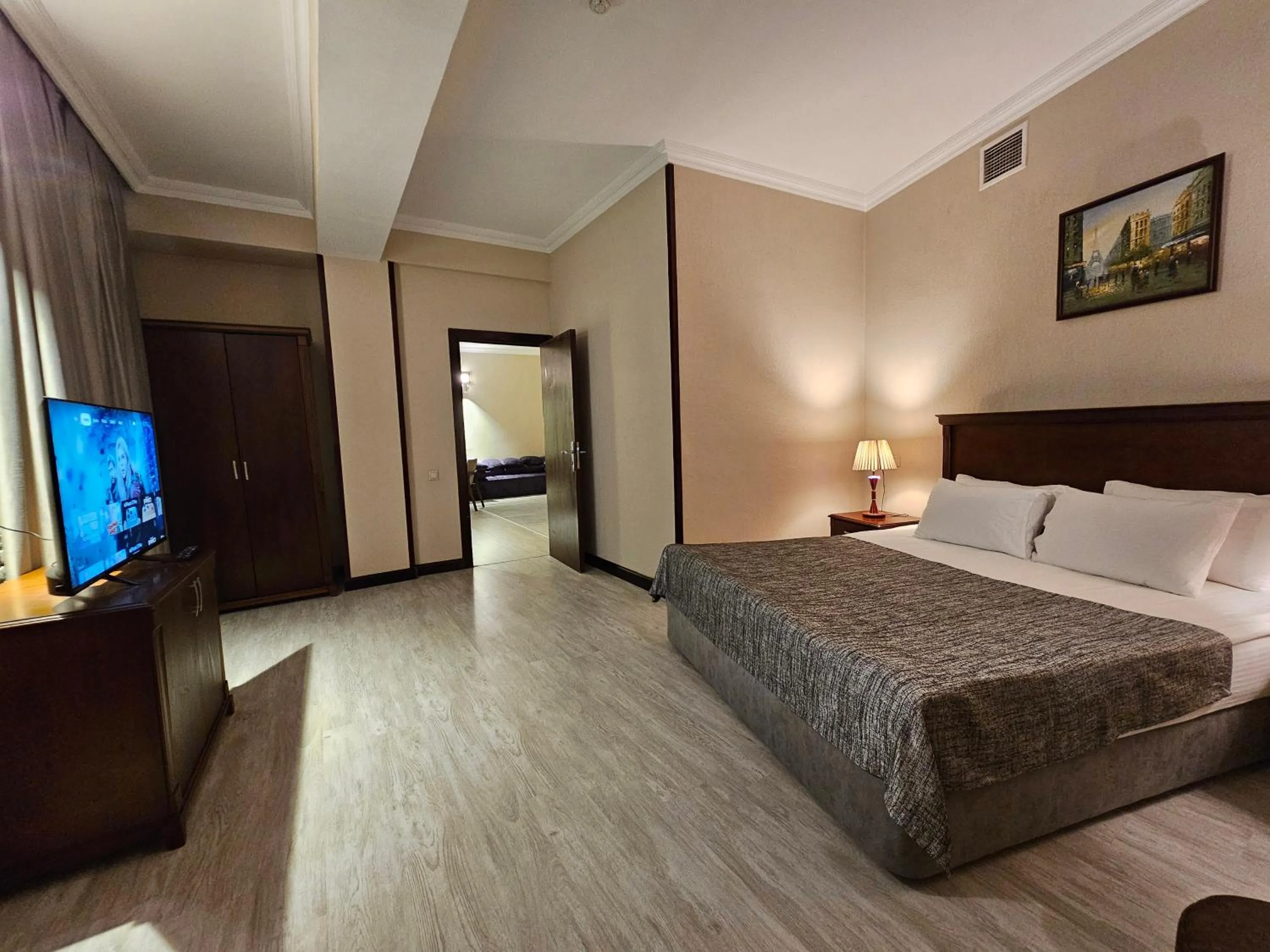 Bed in Crown Suites Hotel