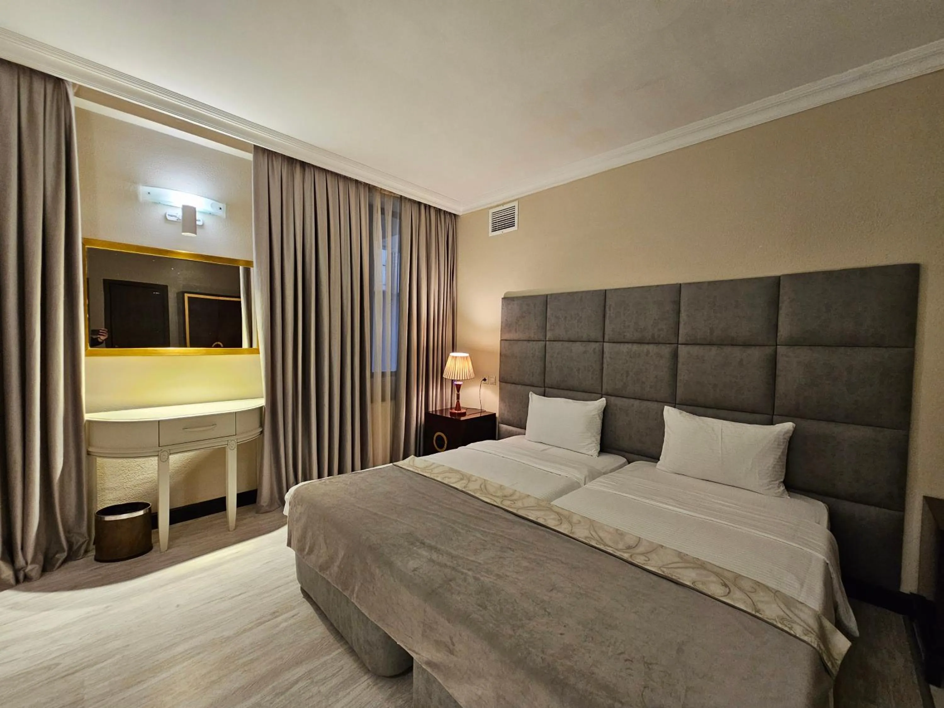 Bed in Crown Suites Hotel