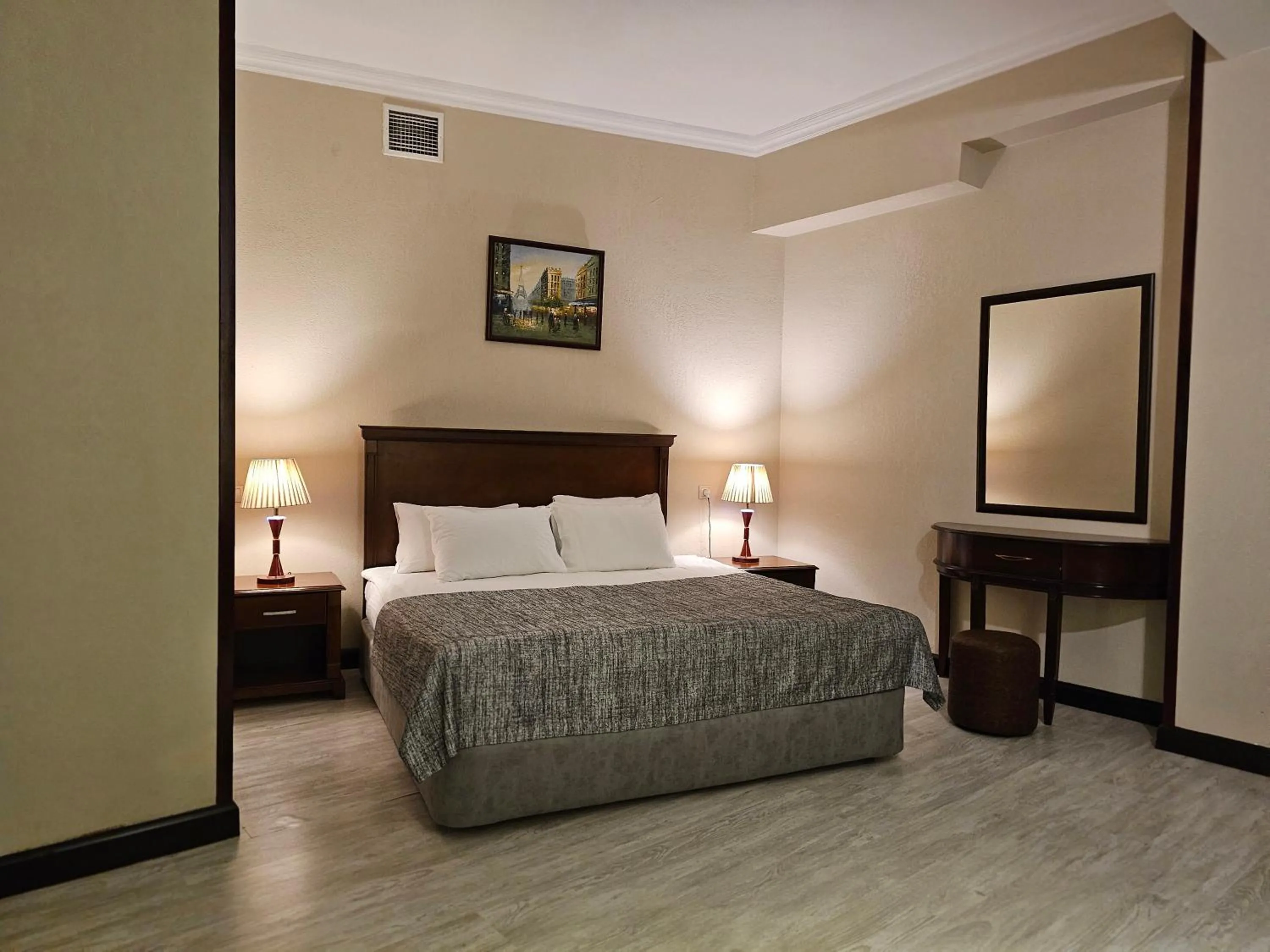 Bed in Crown Suites Hotel