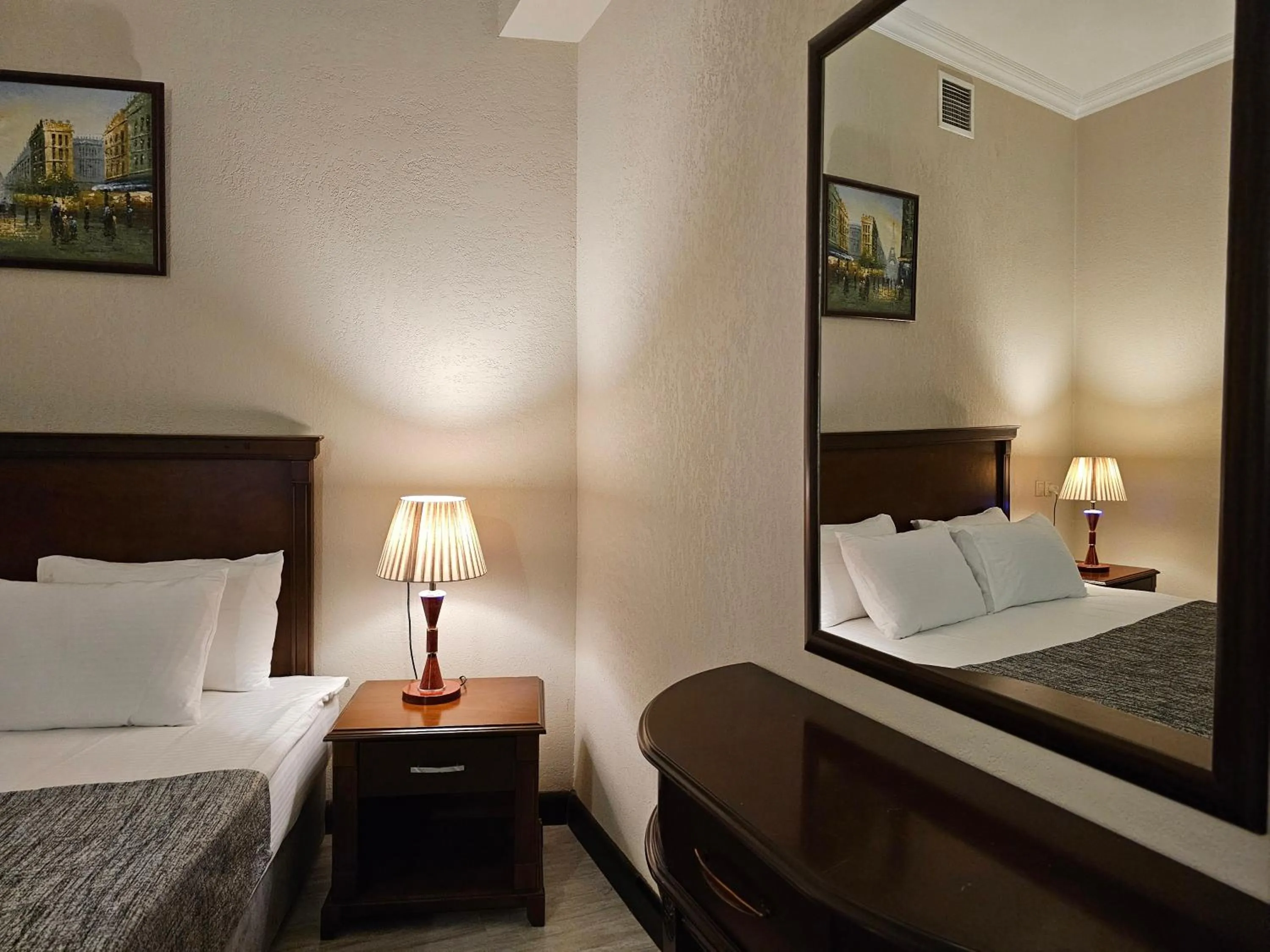 Bed in Crown Suites Hotel