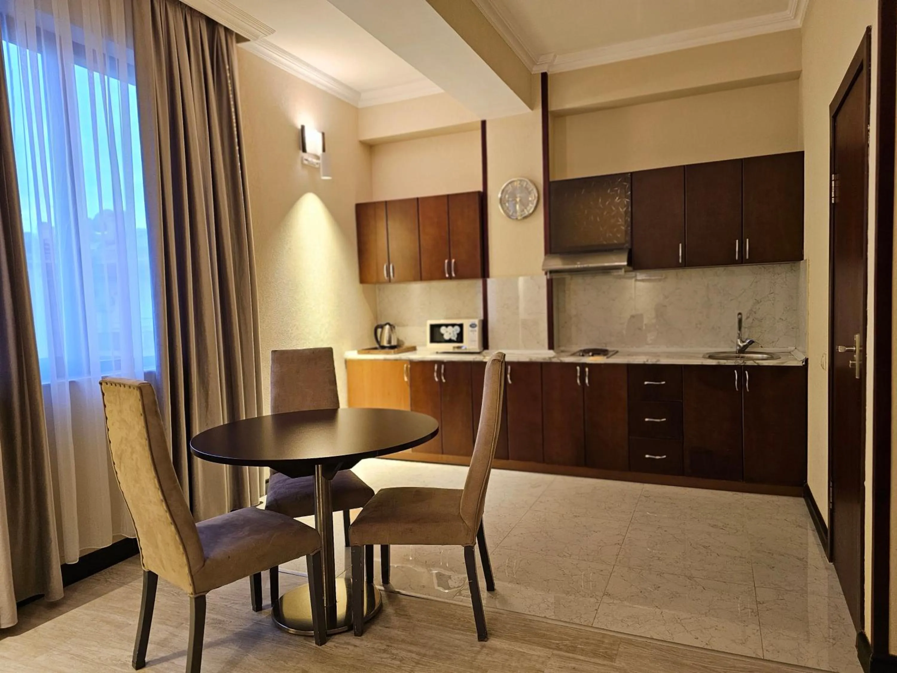 Kitchen or kitchenette in Crown Suites Hotel