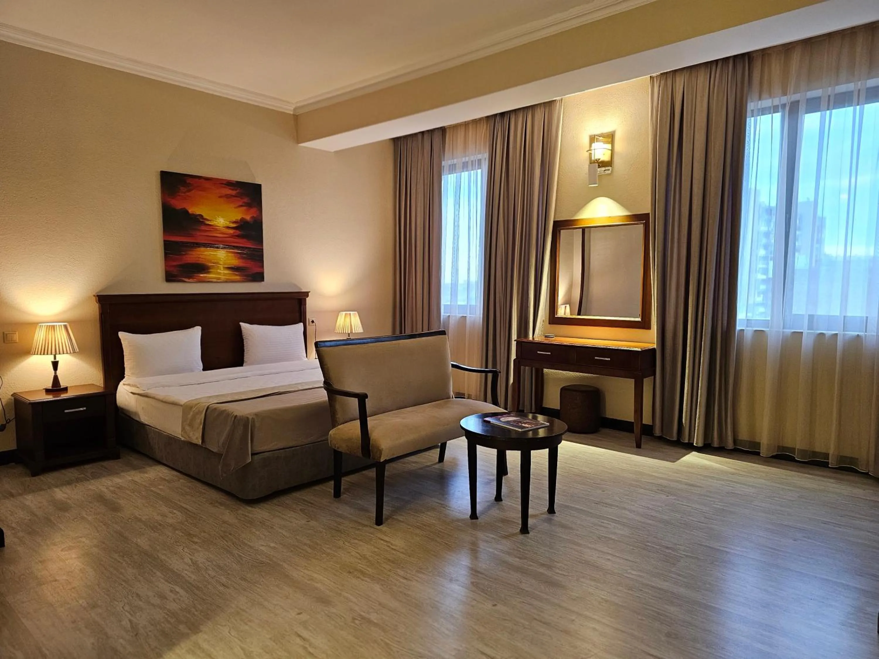 Bed in Crown Suites Hotel