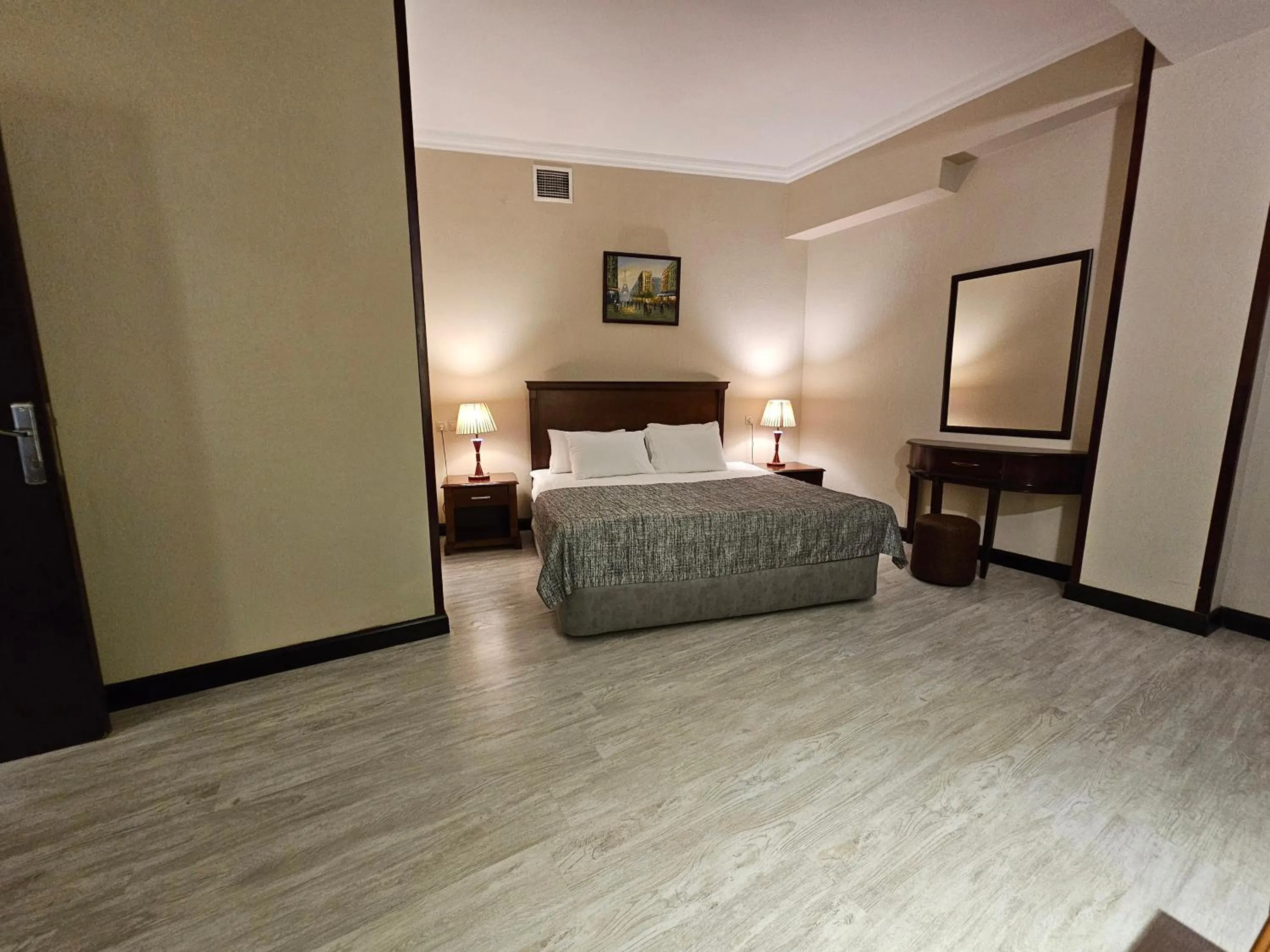 Bed in Crown Suites Hotel