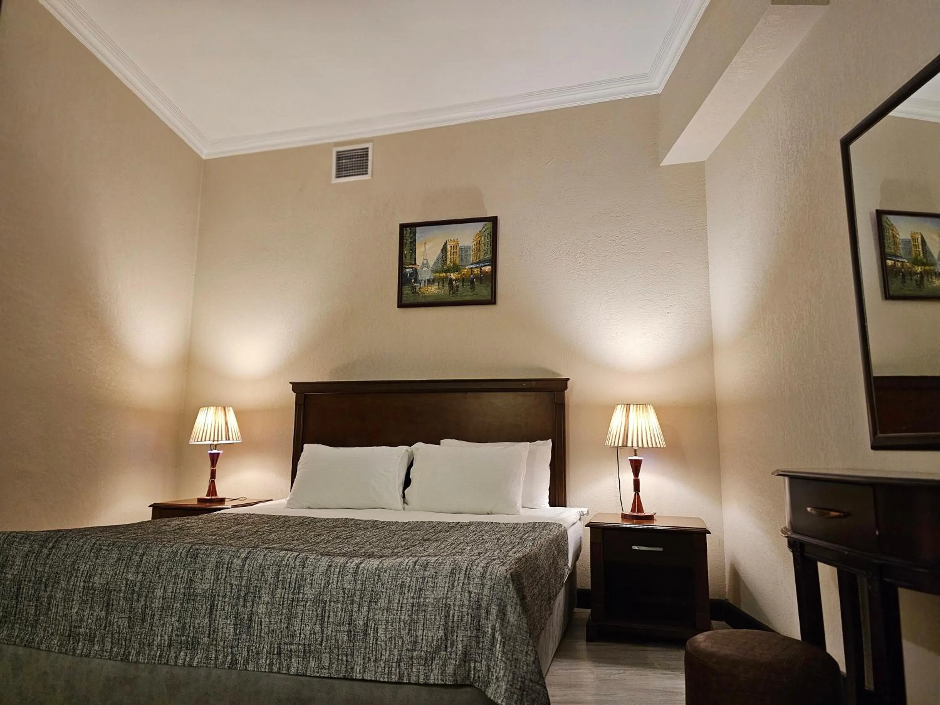 Bed in Crown Suites Hotel