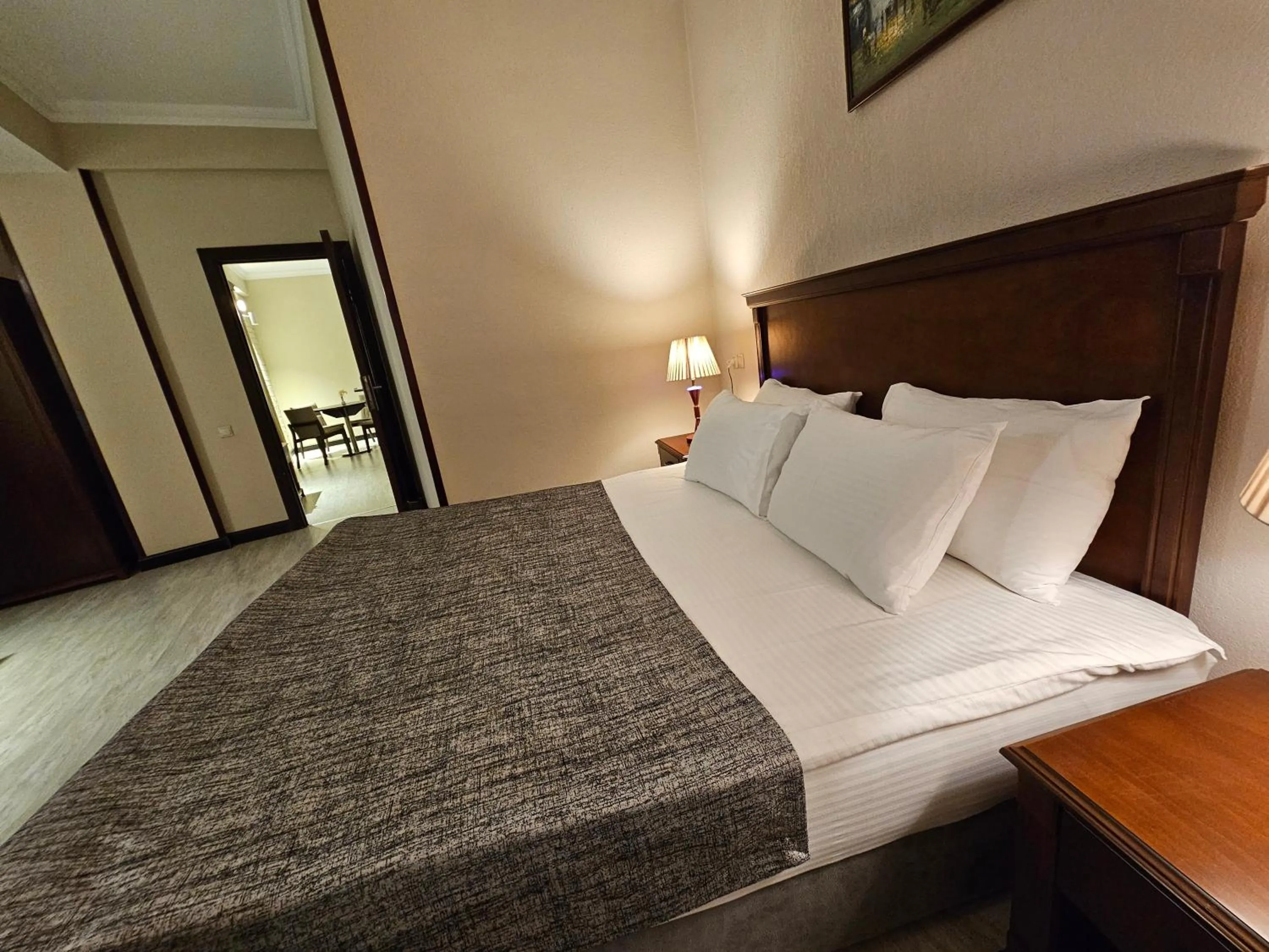 Bed in Crown Suites Hotel
