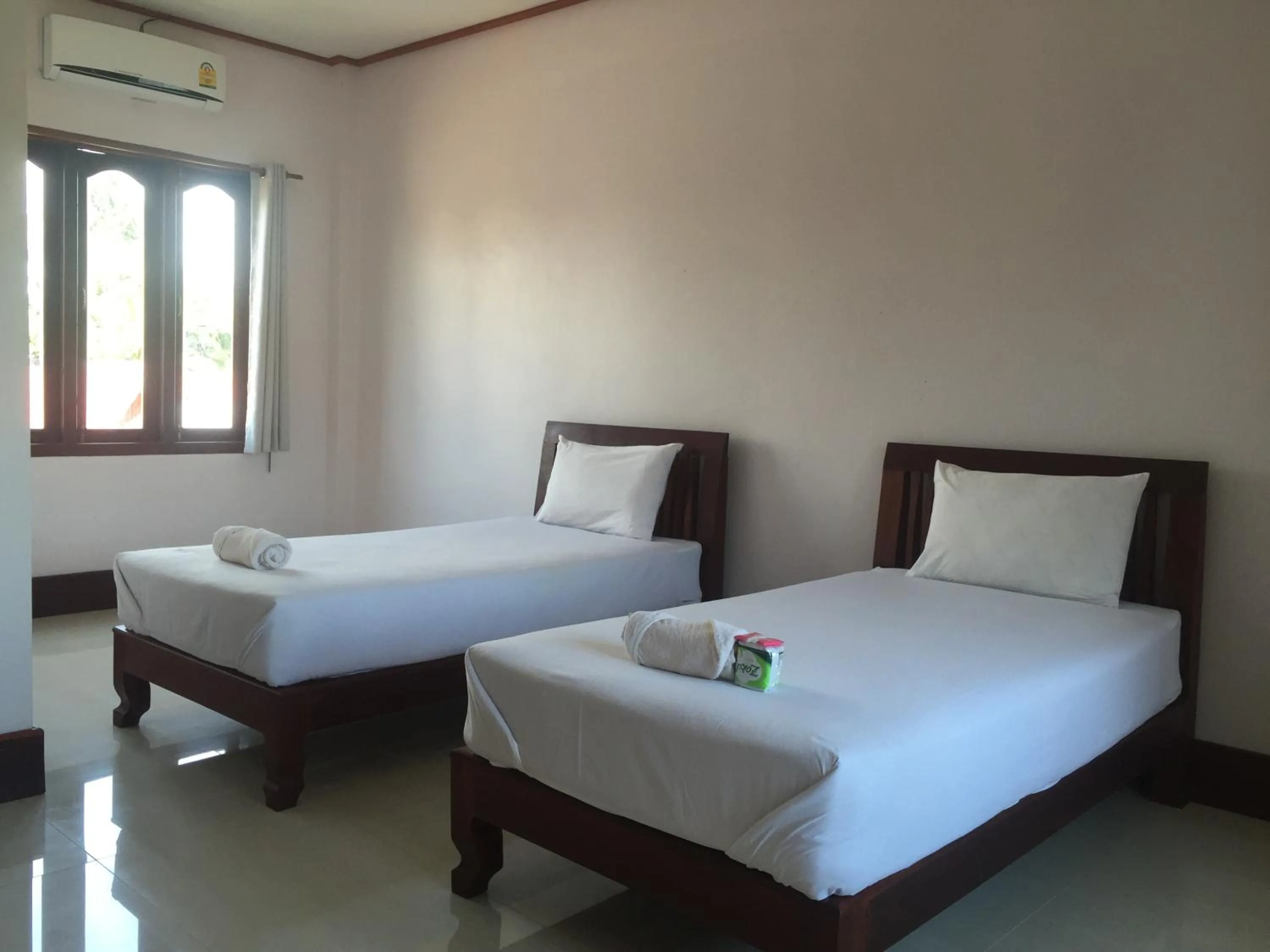 Bed in Mama Leurth Sunset Guesthouse