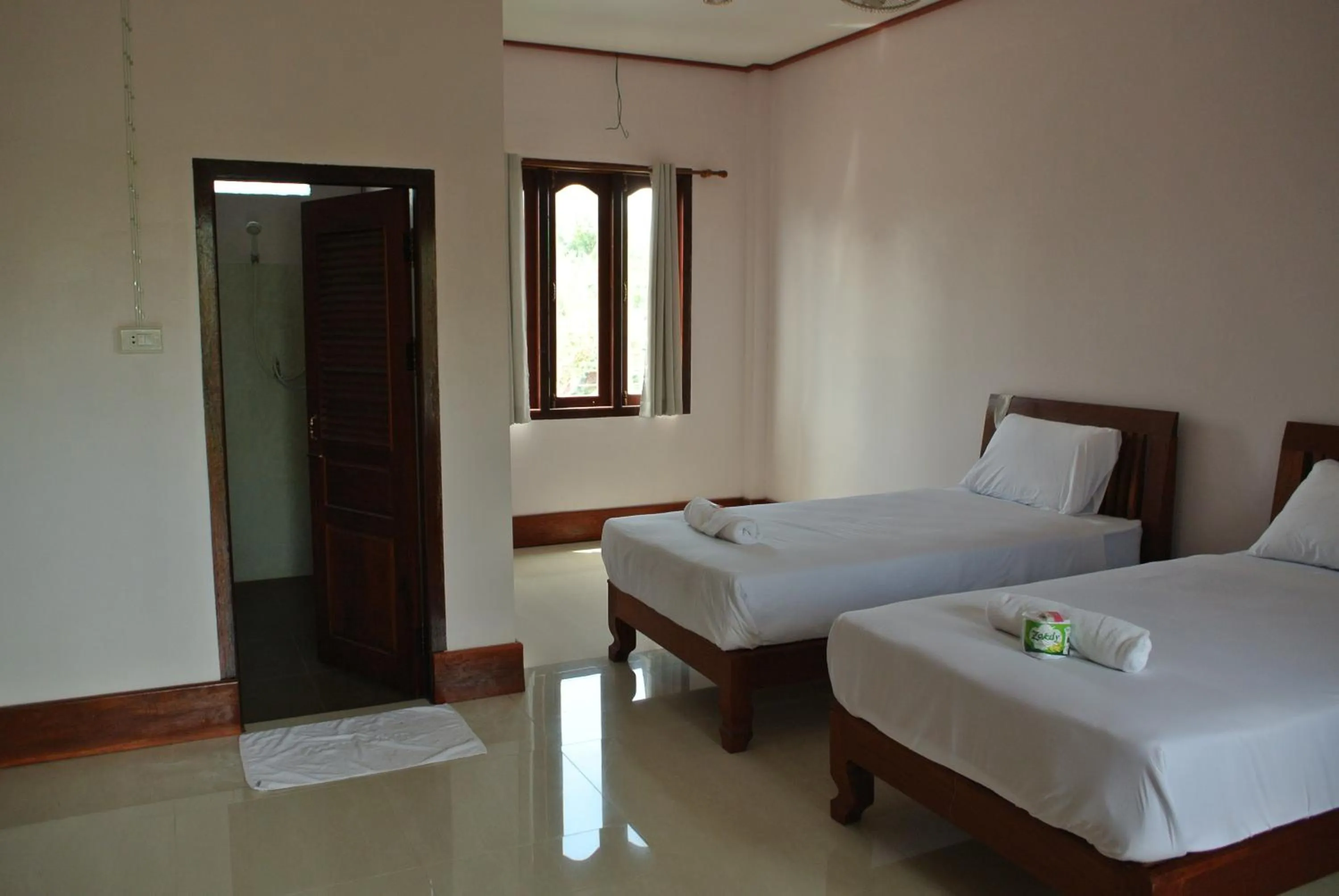 Bed in Mama Leurth Sunset Guesthouse