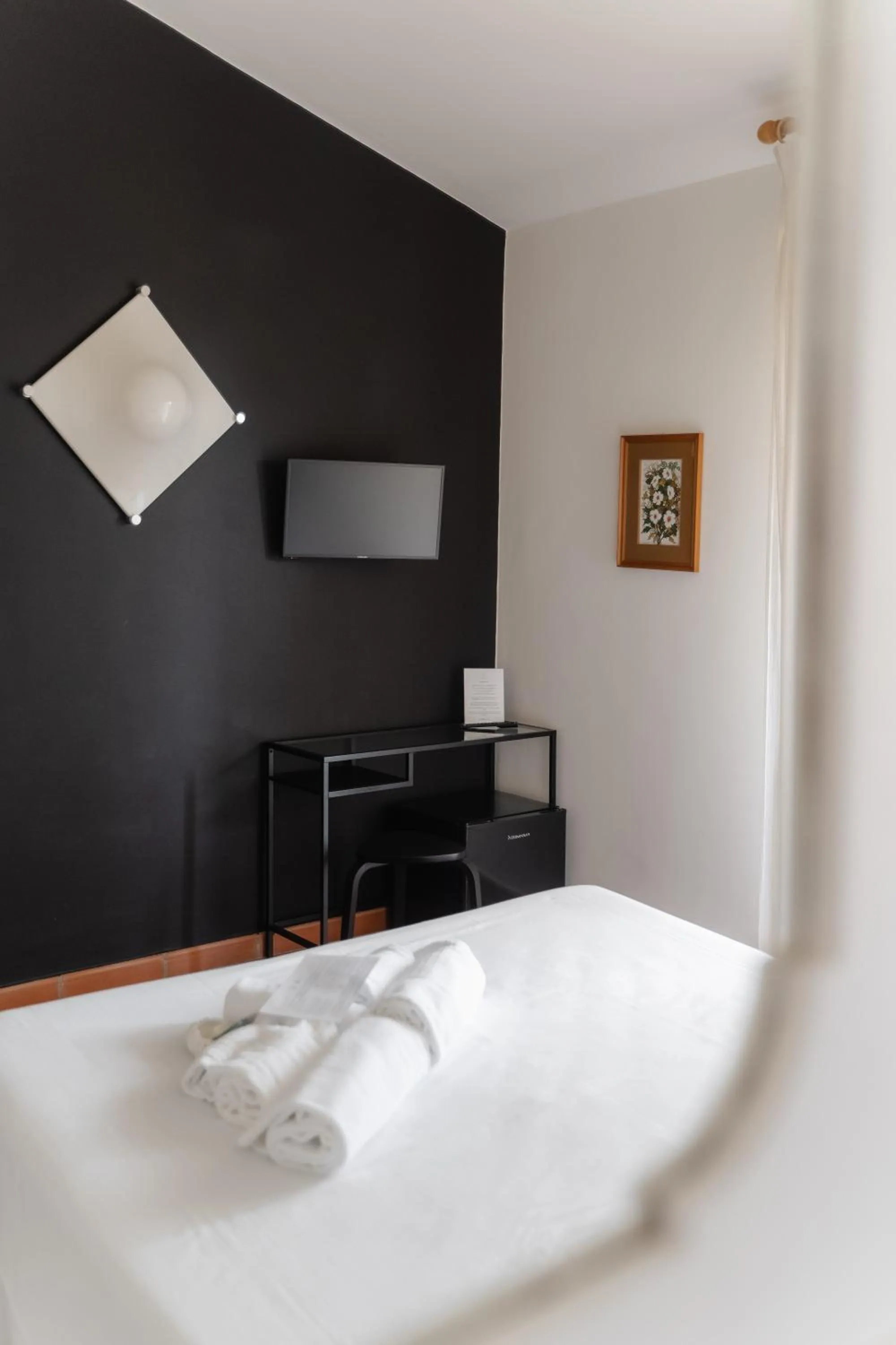 Bed in Mami Sabaudia Hotel