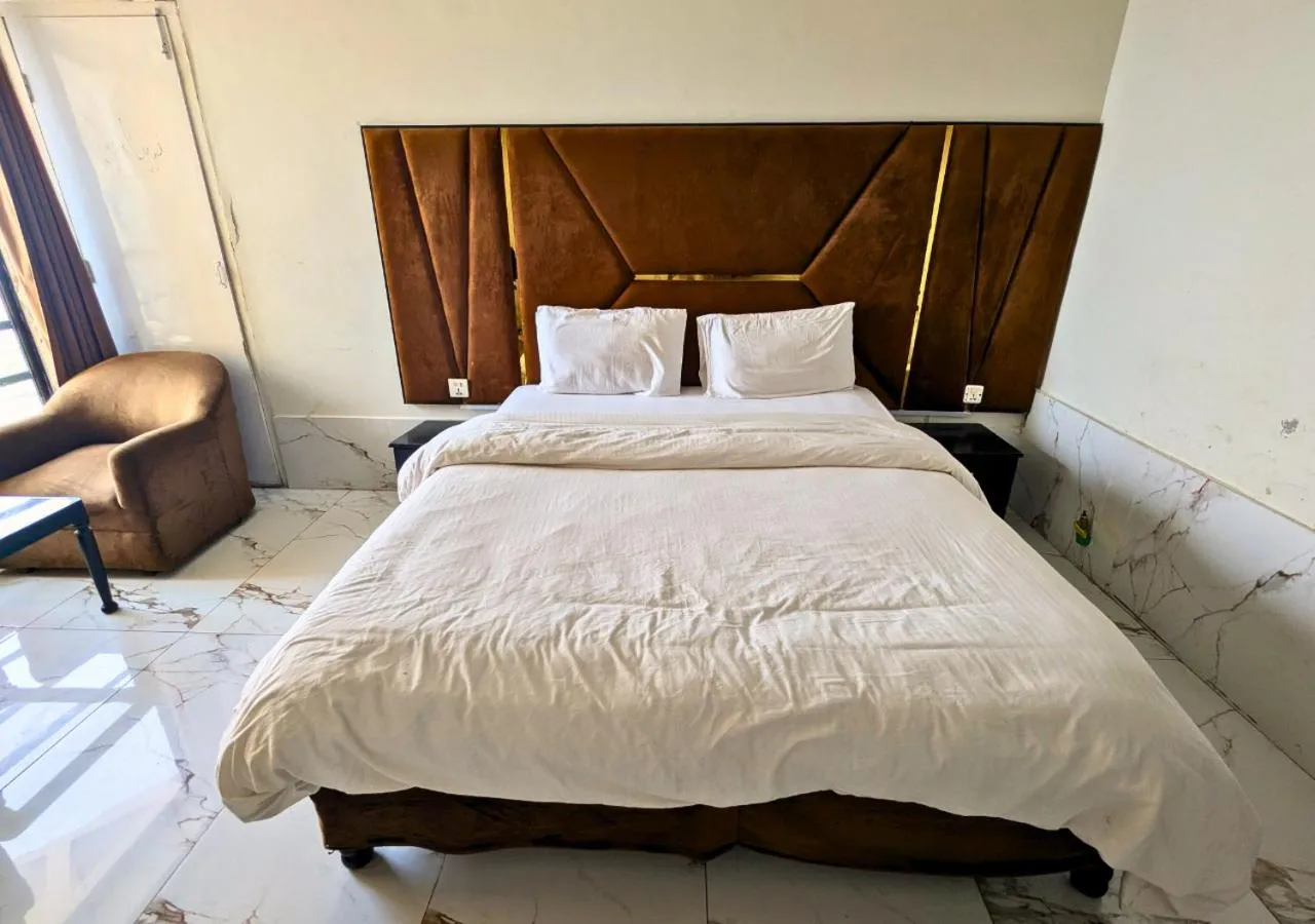 Bed in Grand Heights Hotel