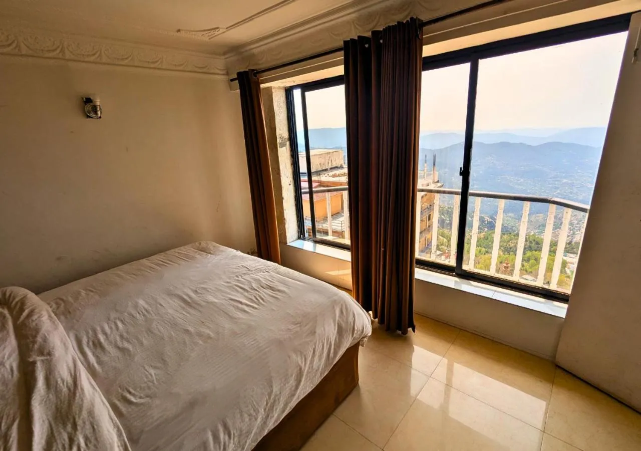 Bed in Grand Heights Hotel