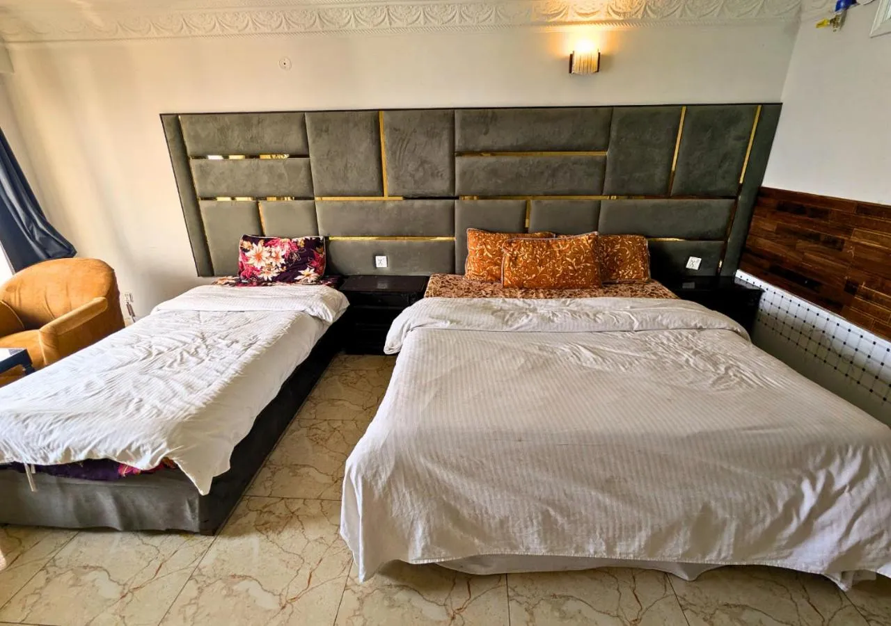 Bed in Grand Heights Hotel