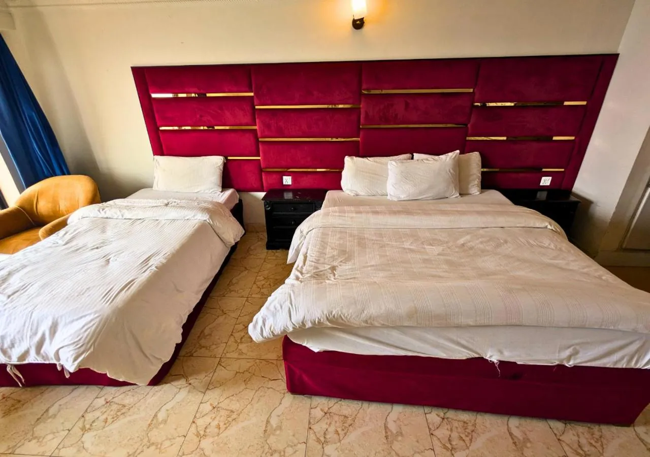 Bed in Grand Heights Hotel