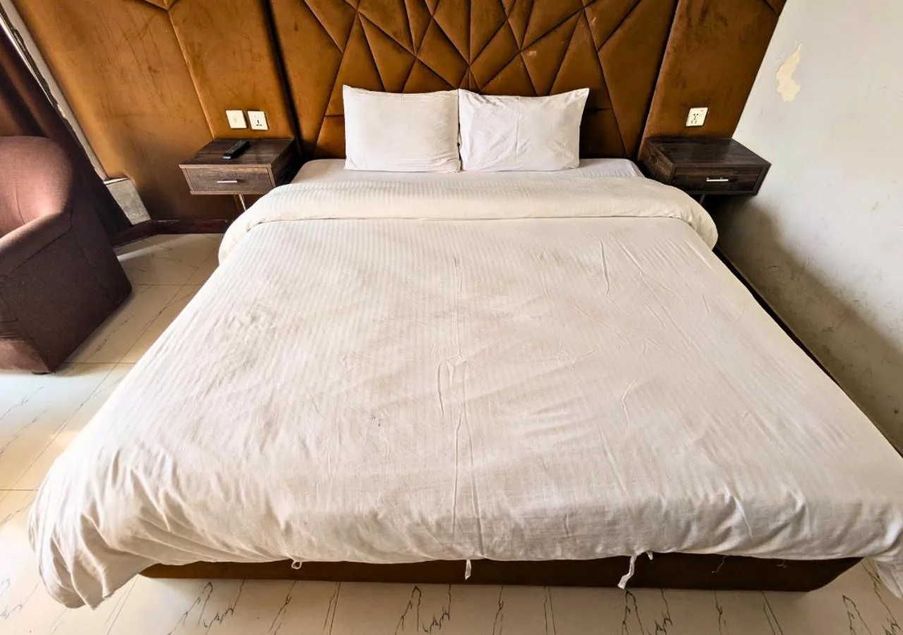 Bed in Grand Heights Hotel