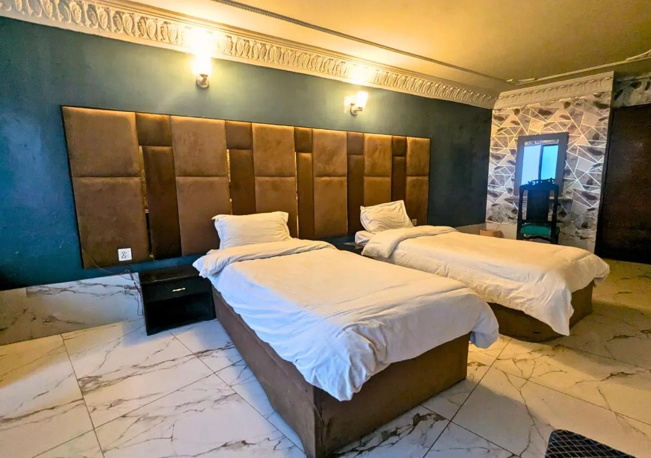 Bed in Grand Heights Hotel