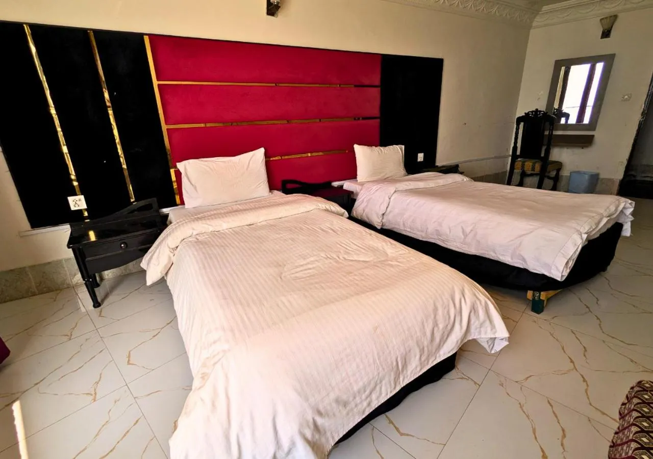 Bed in Grand Heights Hotel
