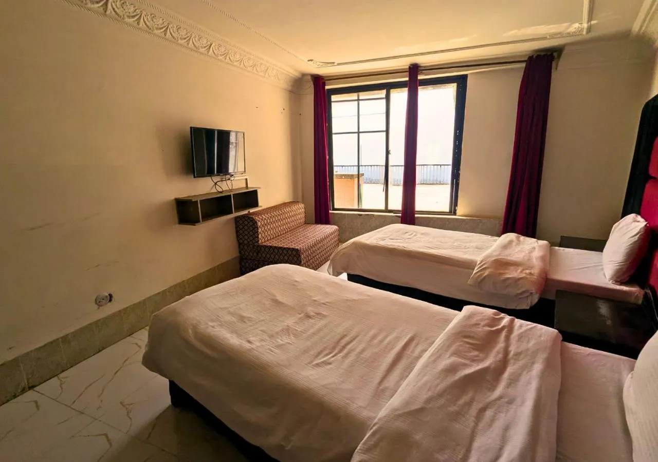 Bed in Grand Heights Hotel