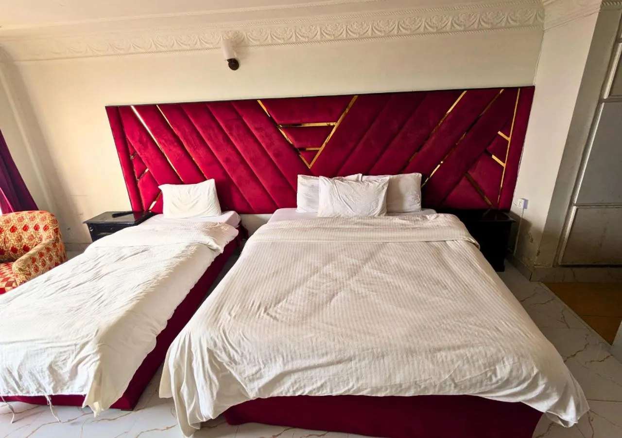 Bed in Grand Heights Hotel